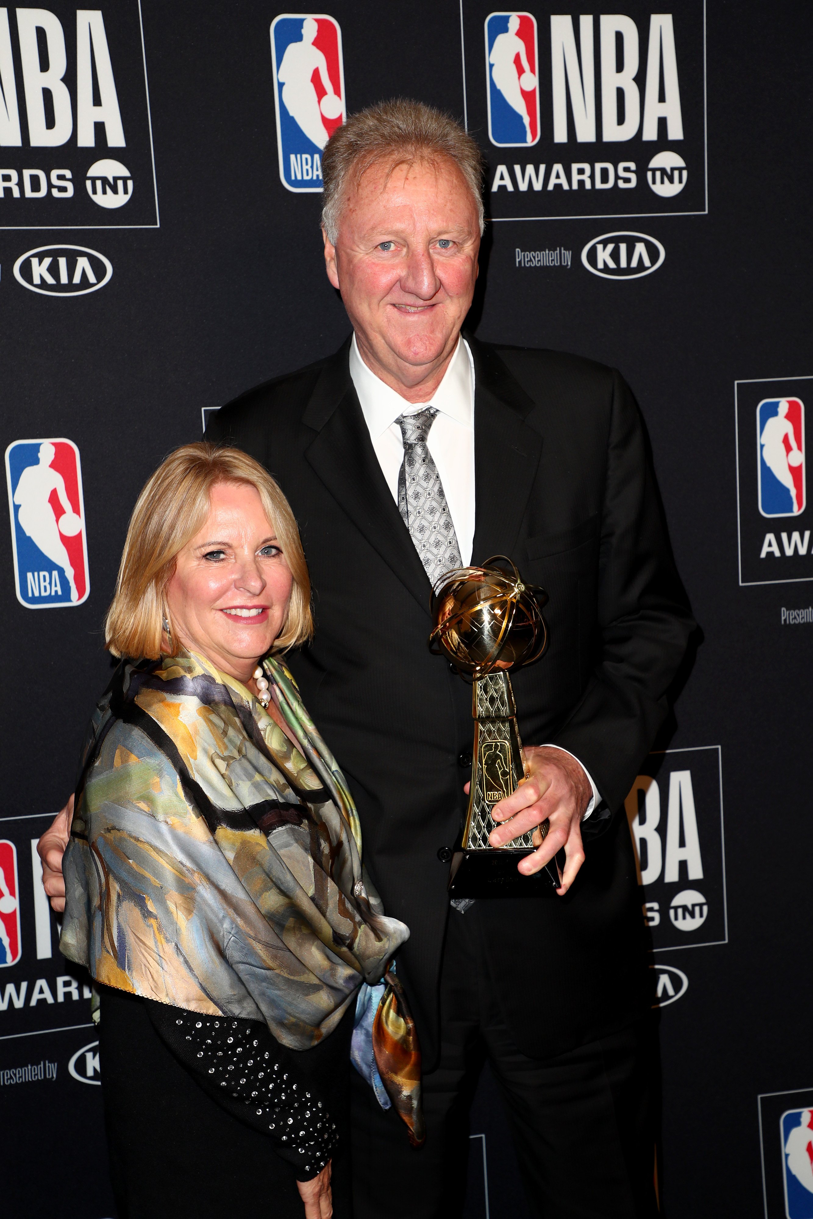 Dinah Mattingly and Larry Bird photographed while posing with the 'Lifetime Achievement' award in the press room during the 2019 NBA Awards in Santa Monica | Source: Getty Images
