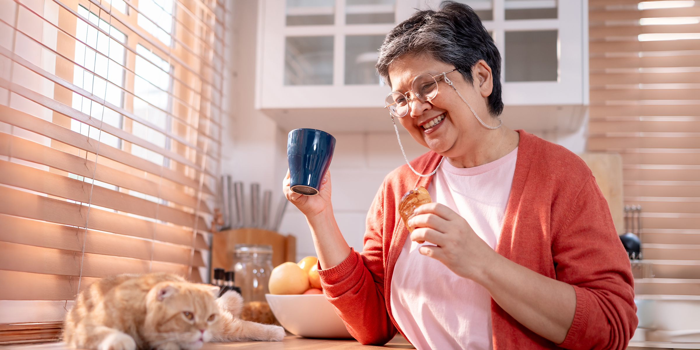 A smiling grandmother in a kitchen | Source: Shutterstock