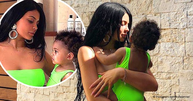 Kylie Jenner and daughter Stormi wear matching neon bathing suits while on tropical getaway