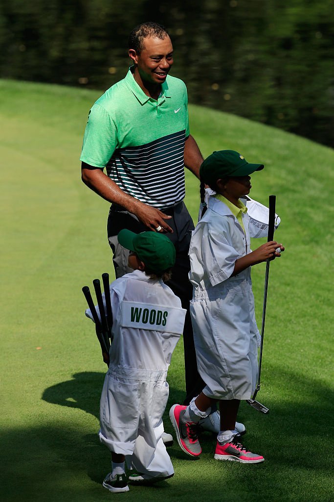 Tiger Woods with his son, Charlie Axel and daughter, Sam Alexis during the Par 3 Contest before the start of the 2015 Masters Tournament in Augusta on April 8, 2015. | Photo: Getty Images