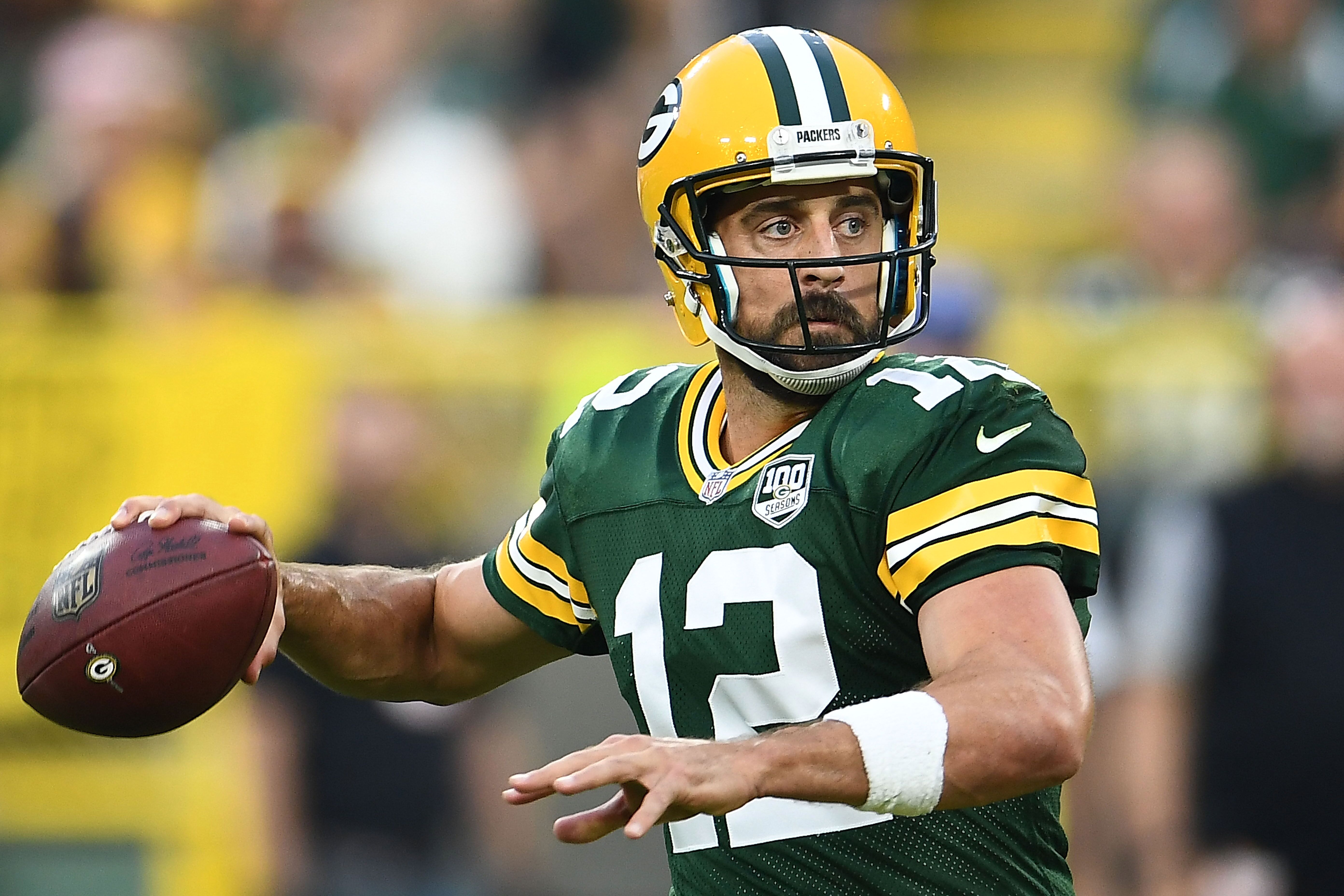 Aaron Rodgers #12 of the Green Bay Packers drops back to pass during a preseason game against the Pittsburgh Steelers at Lambeau Field on August 16, 2018 in Green Bay, Wisconsin. | Source: Getty Images