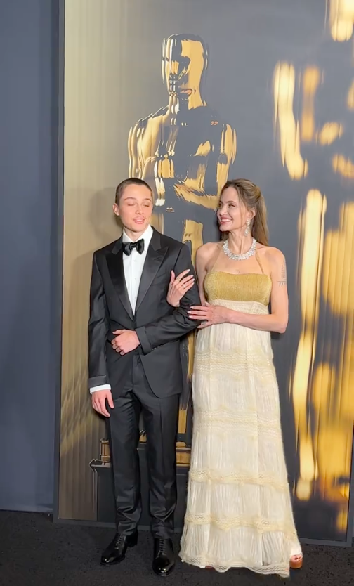 Knox Jolie-Pitt and Angelina Jolie posing for the cameras at the Governors Awards, posted on November 18, 2024 | Source: TikTok/hollywoodreporter