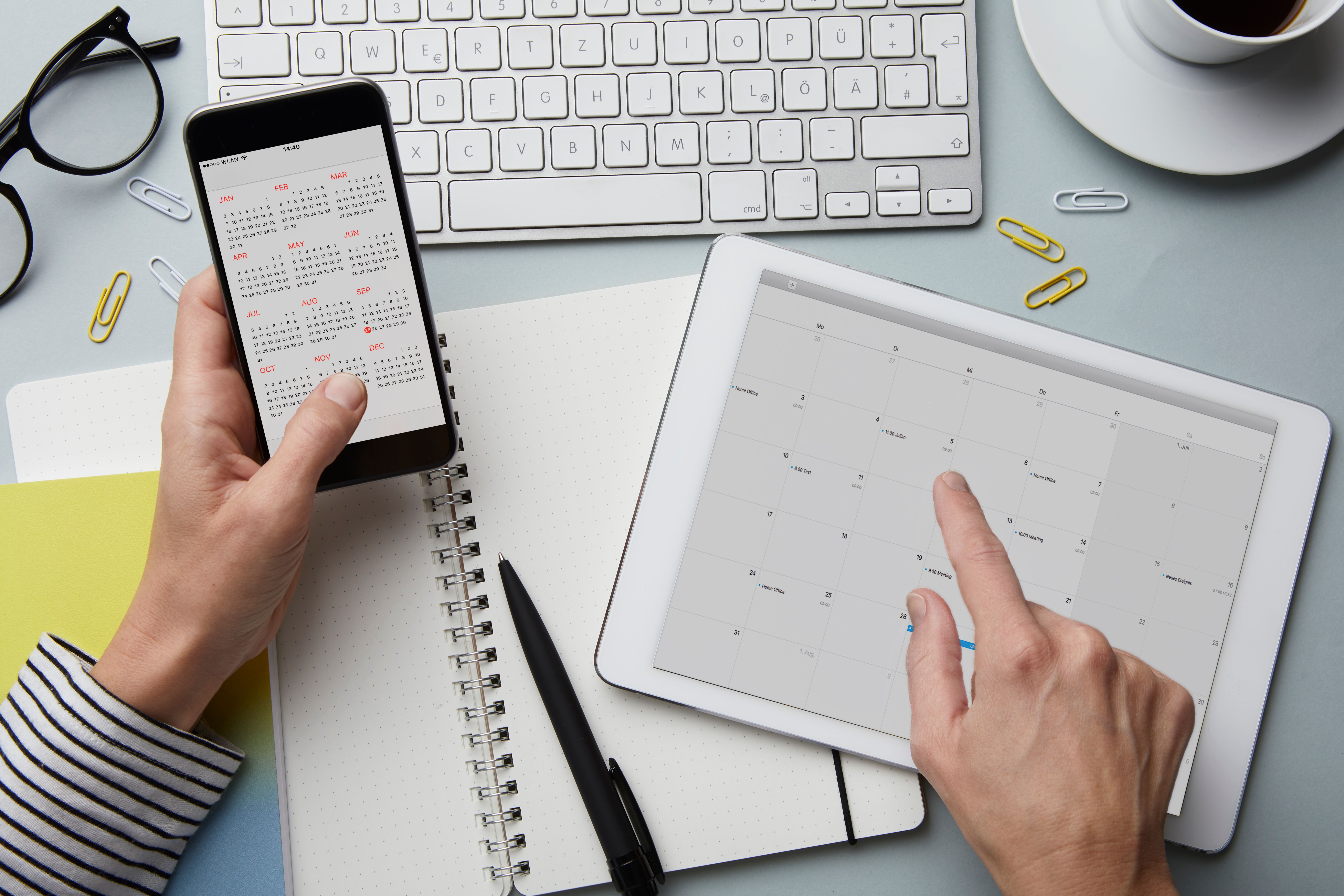 Calendars open on a phone and tablet. | Source: Getty Images