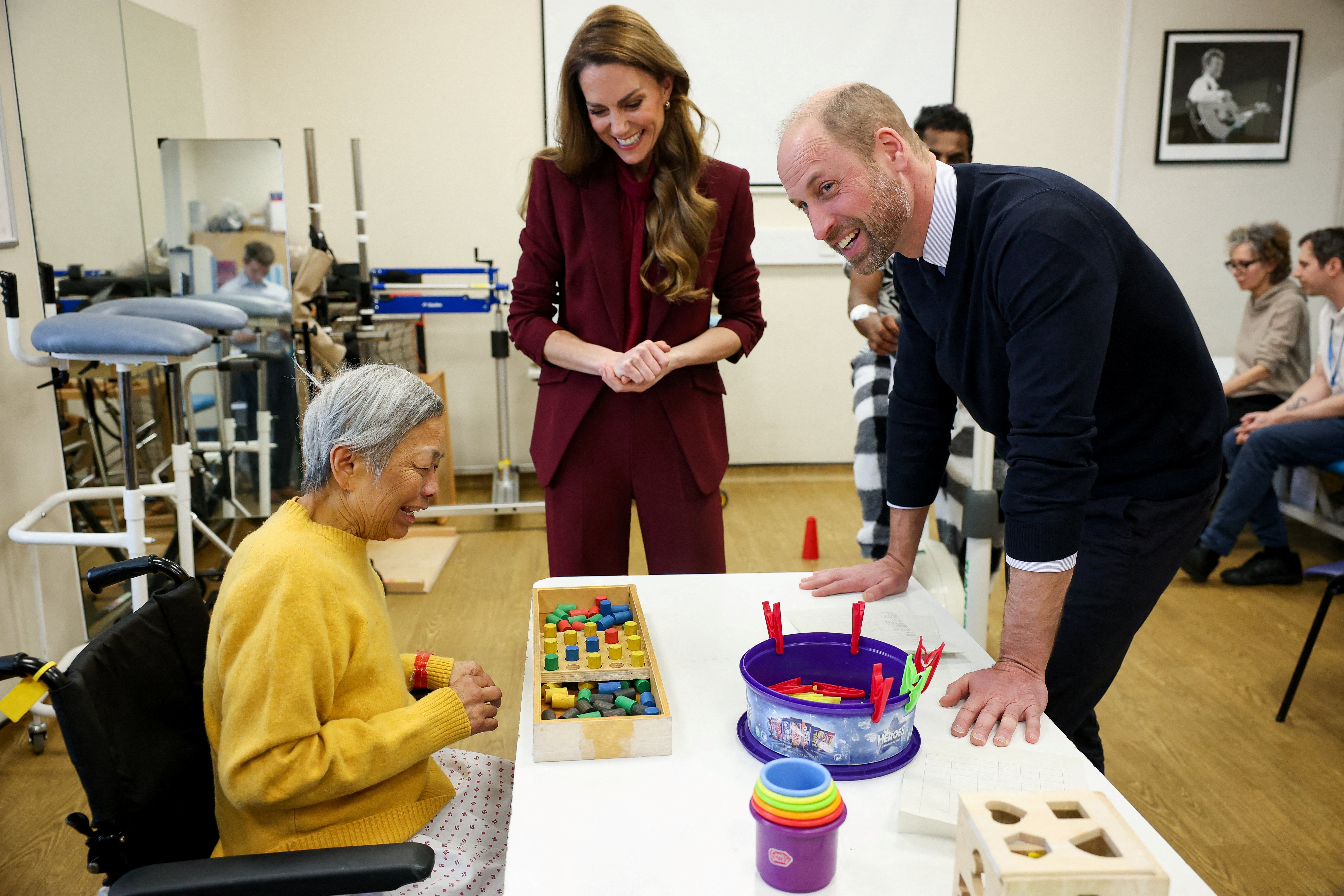 Prince William and Catherine, Princess of Wales speak to a patient at the therapy gym during a visit to Charing Cross Hospital in west London on 8 January 2026. | Source: Getty Images