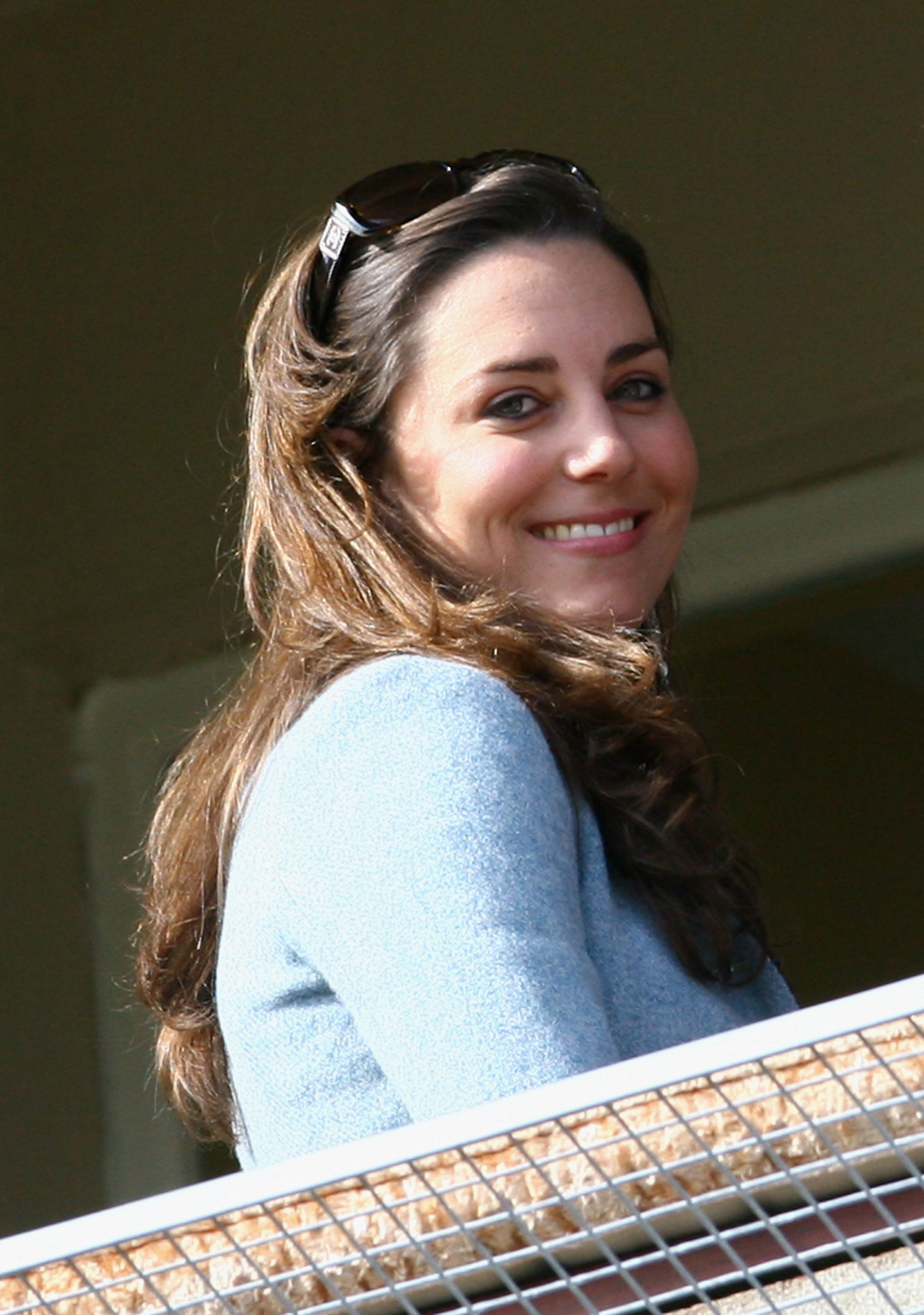 Offering a warm smile from the stands, Kate Middleton appears perfectly at ease amid the pageantry of race day, as public fascination with Prince William's longtime girlfriend continued to grow.