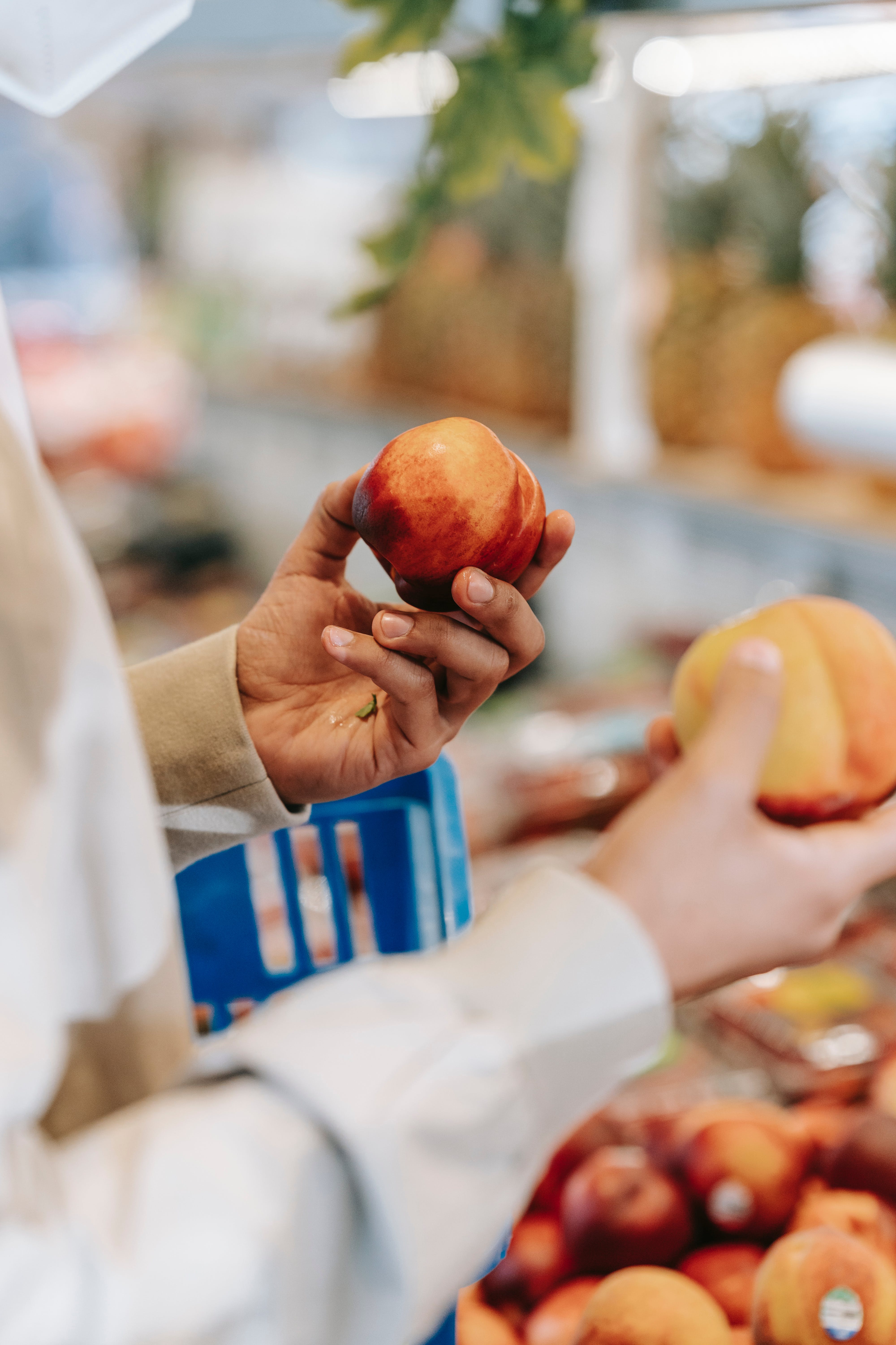 Someone packing fruit in a store | Source: Pexels
