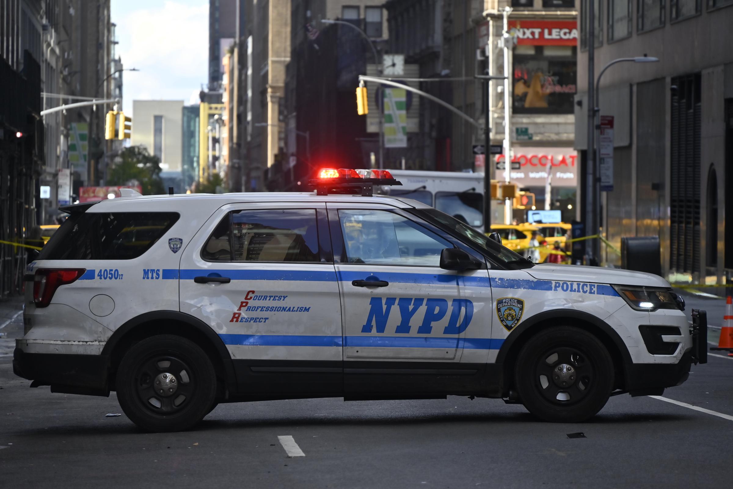 NYPD officers maintain a security cordon after Kris Boyd was shot and critically hurt outside a restaurant in Midtown, Manhattan, New York, on November 16, 2025 | Source: Getty Images