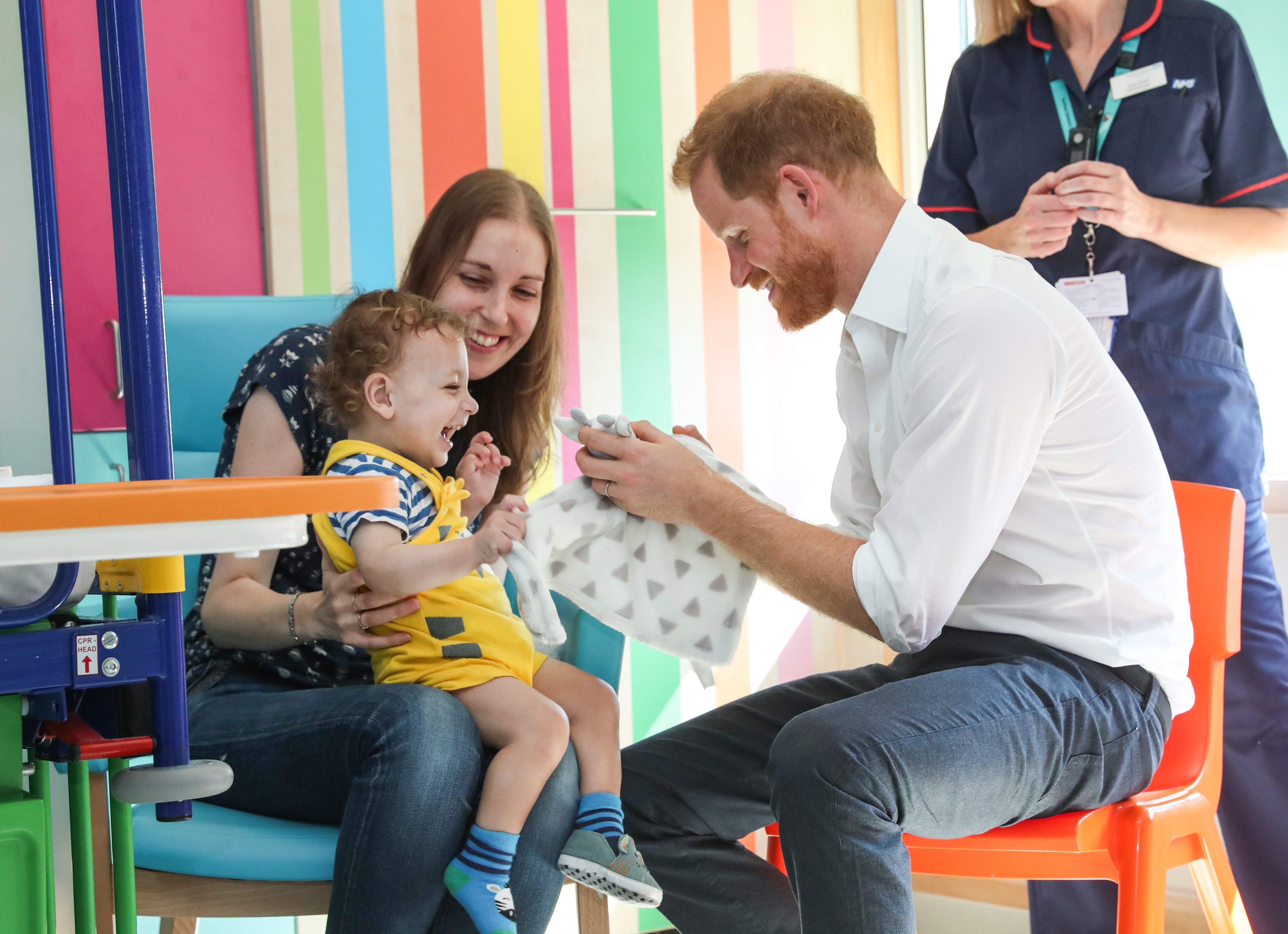 Prince Harry interacts with Noah Nicholson during a visit to Sheffield Children's Hospital on Thursday July 26, 2019 | Photo:Getty Images