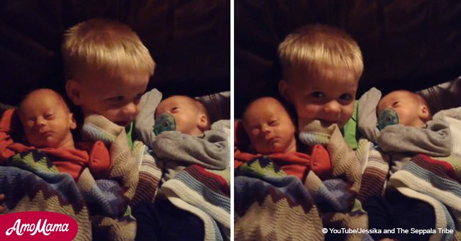Toddler brother won't let go of new baby twins