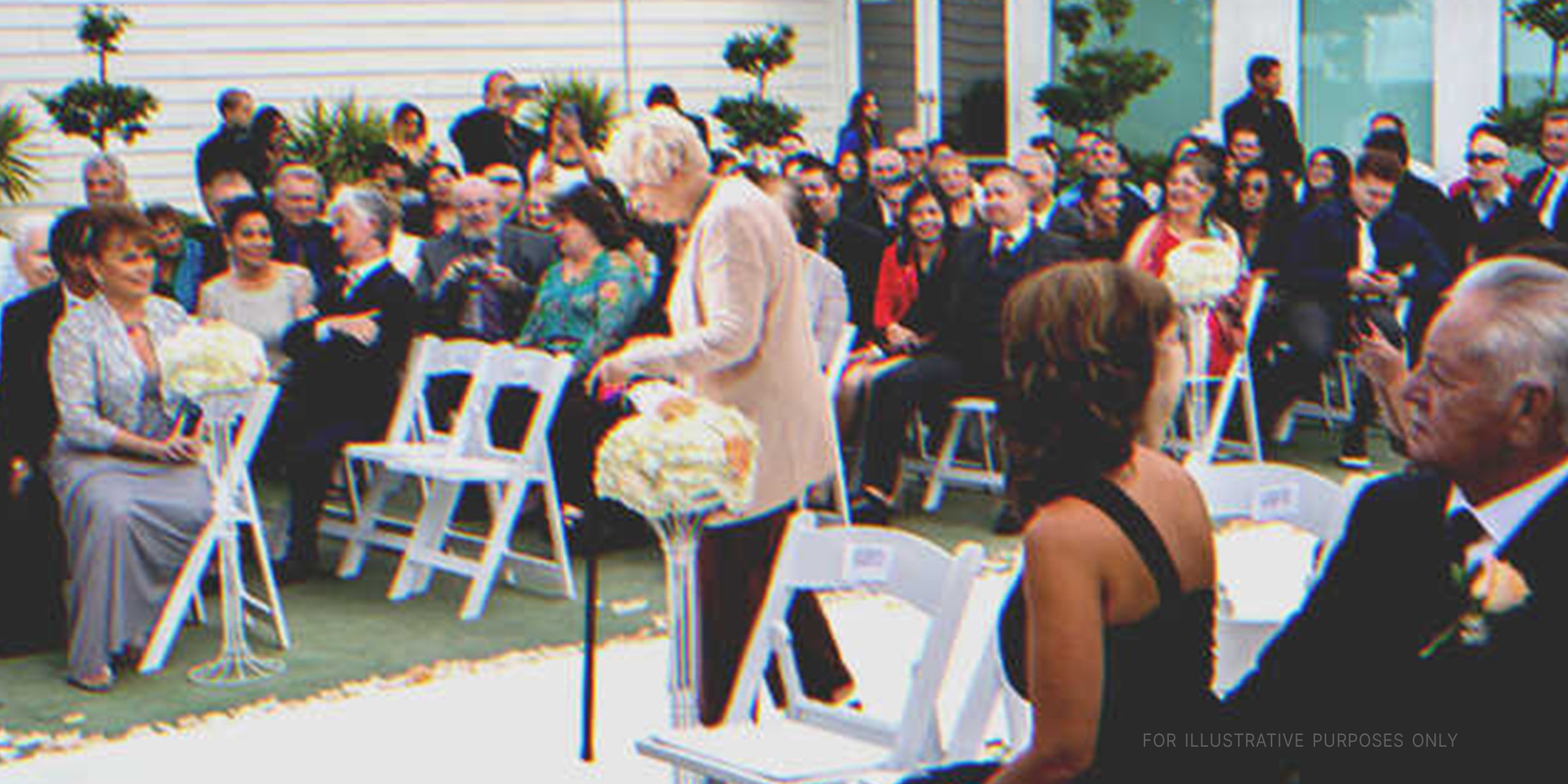 An older woman in a wedding. | Shutterstock