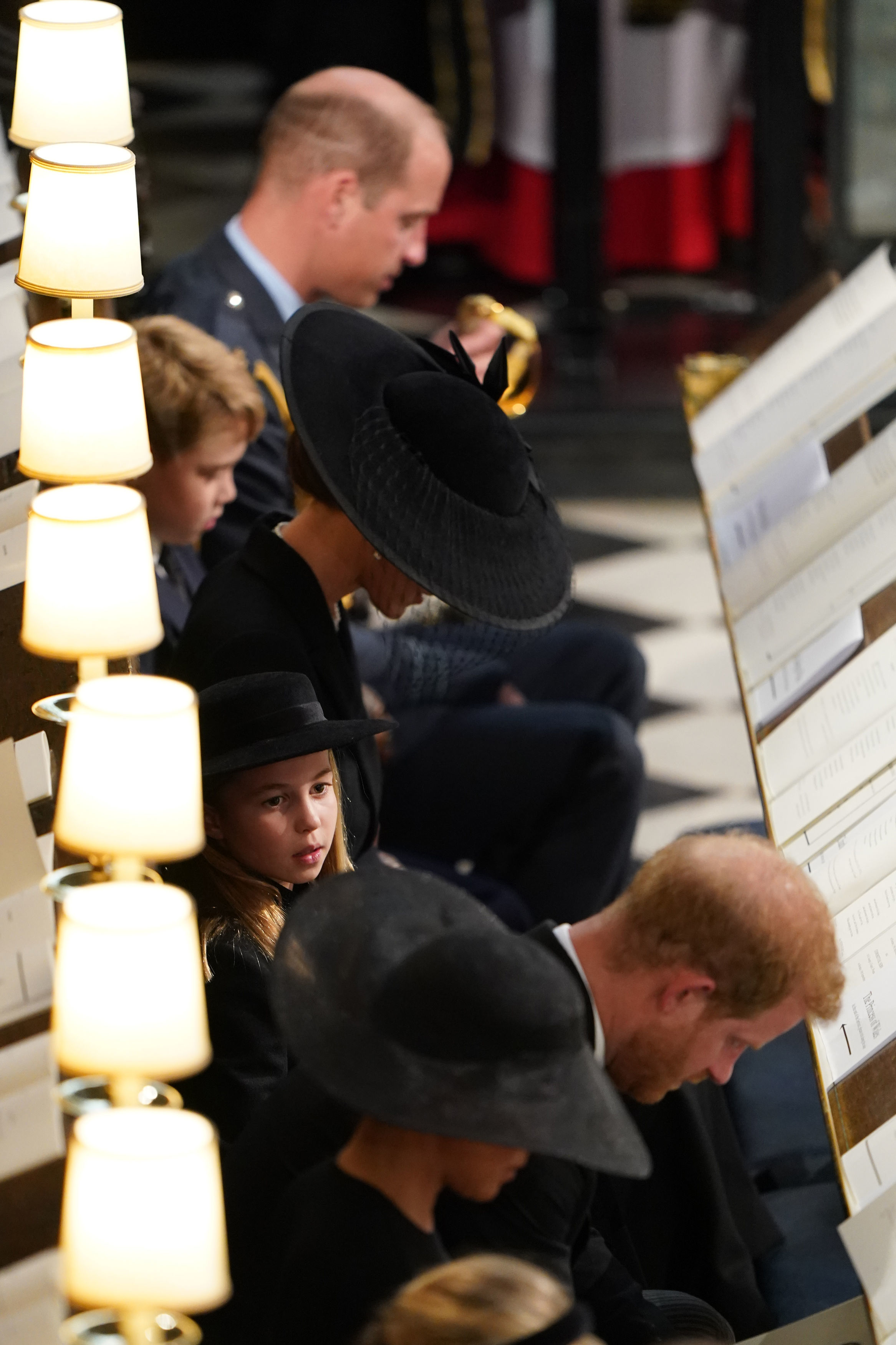 Prince William and Prince Harry with Prince George, Princess Catherine, Princess Charlotte and Meghan Markle at the Committal Service for the late Queen Elizabeth II in Windsor, England on September 19, 2022 | Source: Getty Images