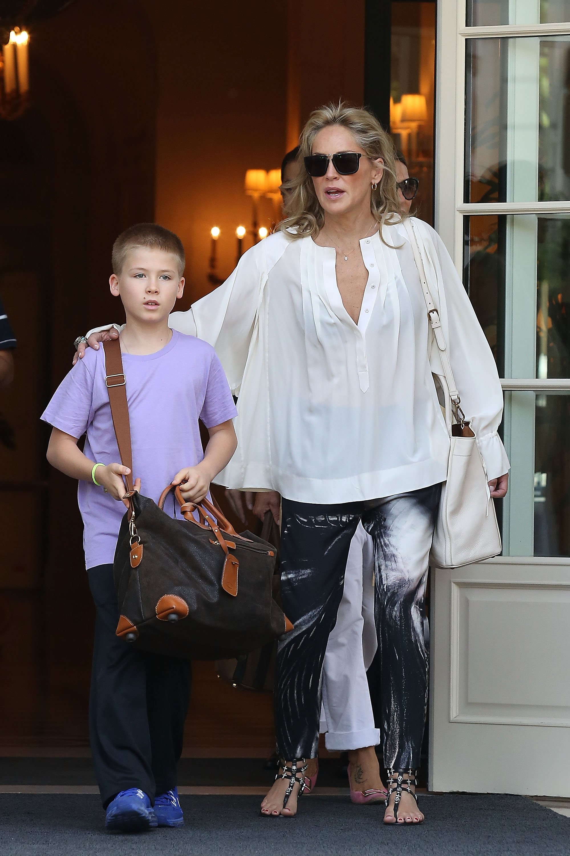 Sharon Stone and her son Roan Bronstein seen leaving her hotel on July 5, 2013, in Paris, France. | Source: Marc Piasecki/FilmMagic/Getty Images