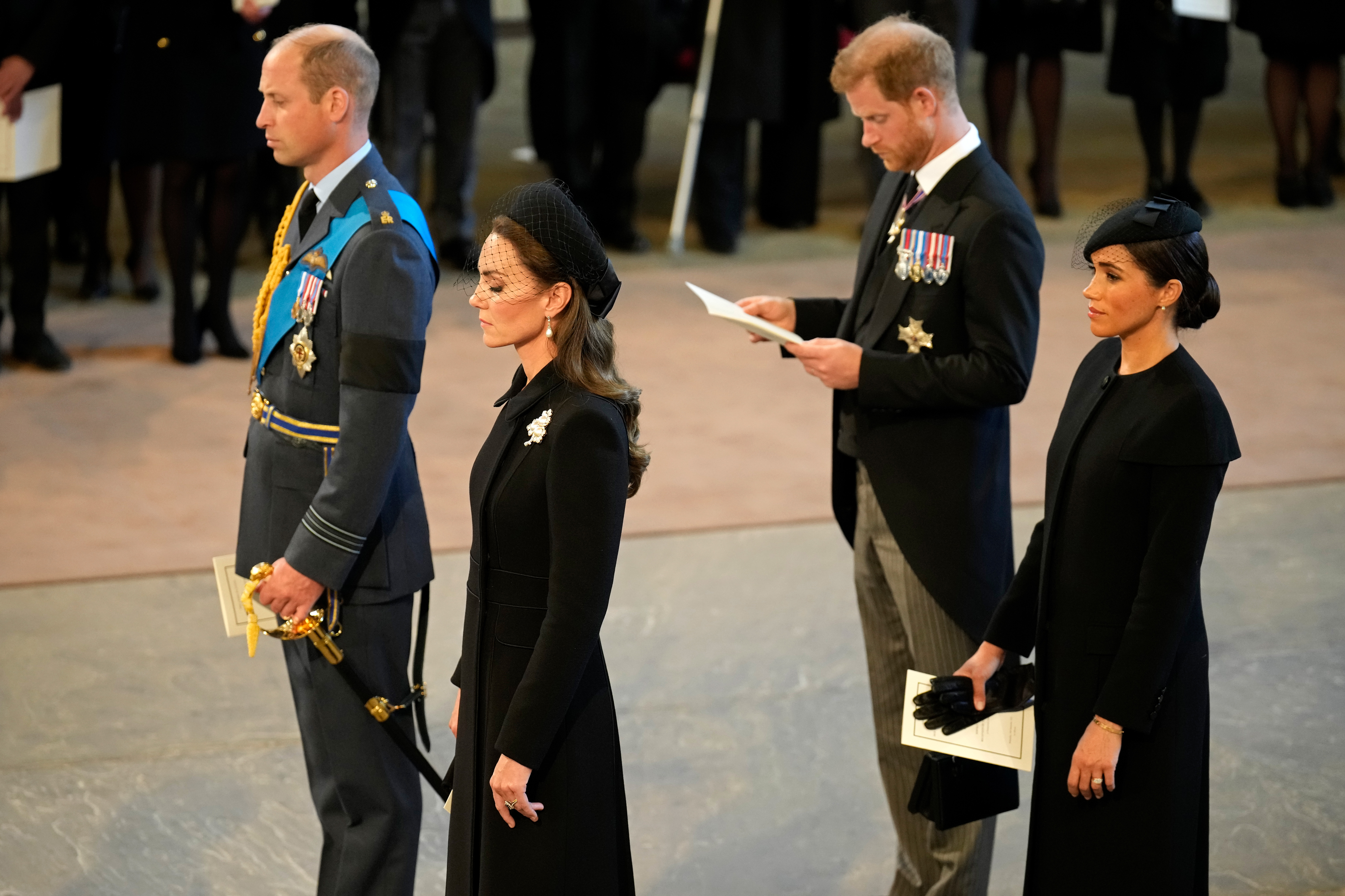 Prince William, Prince of Wales, Catherine, Princess of Wales, Prince Harry, Duke of Sussex and Meghan, Duchess of Sussex during the Lying-in State of Queen Elizabeth II on September 14, 2022 in London, England | Source: Getty Images