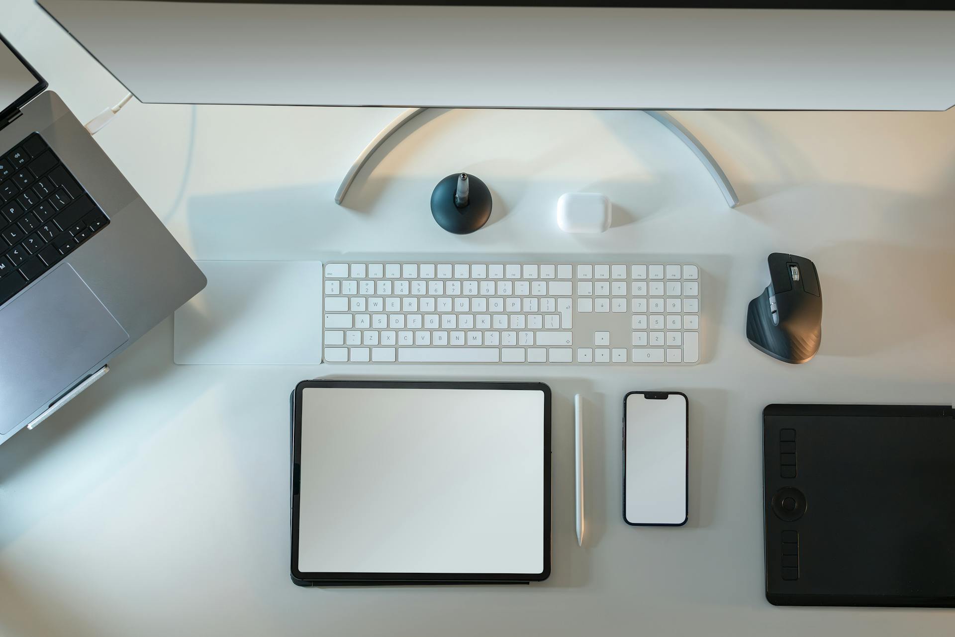 Wireless electronic devices lying on a desk | Source: Pexels