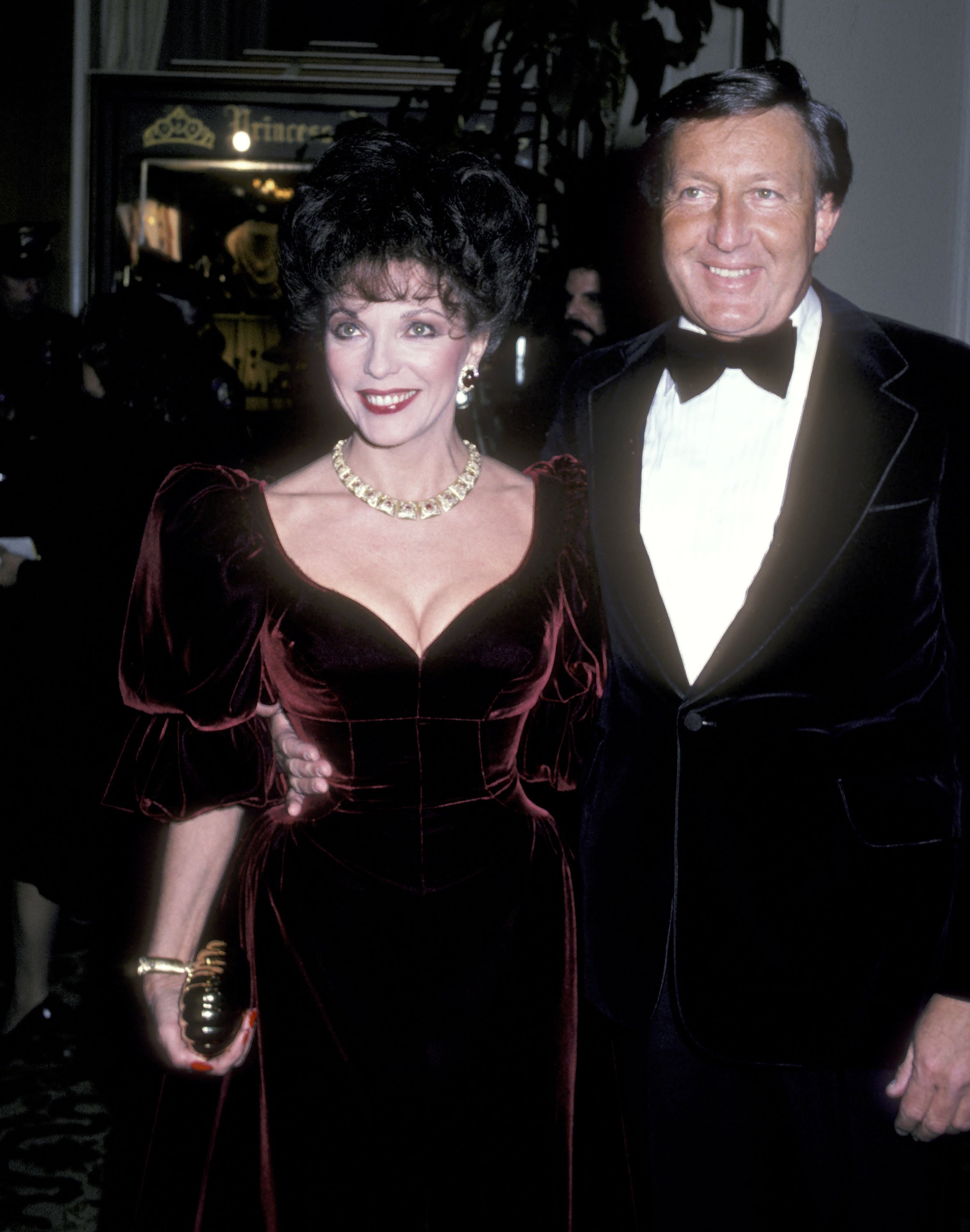 Joan Collins and her husband Ronald S. Kass during the 39th Annual Golden Globe Awards at Beverly Hilton Hotel on January 30, 1982 in Beverly Hills, California. | Source: Getty Images