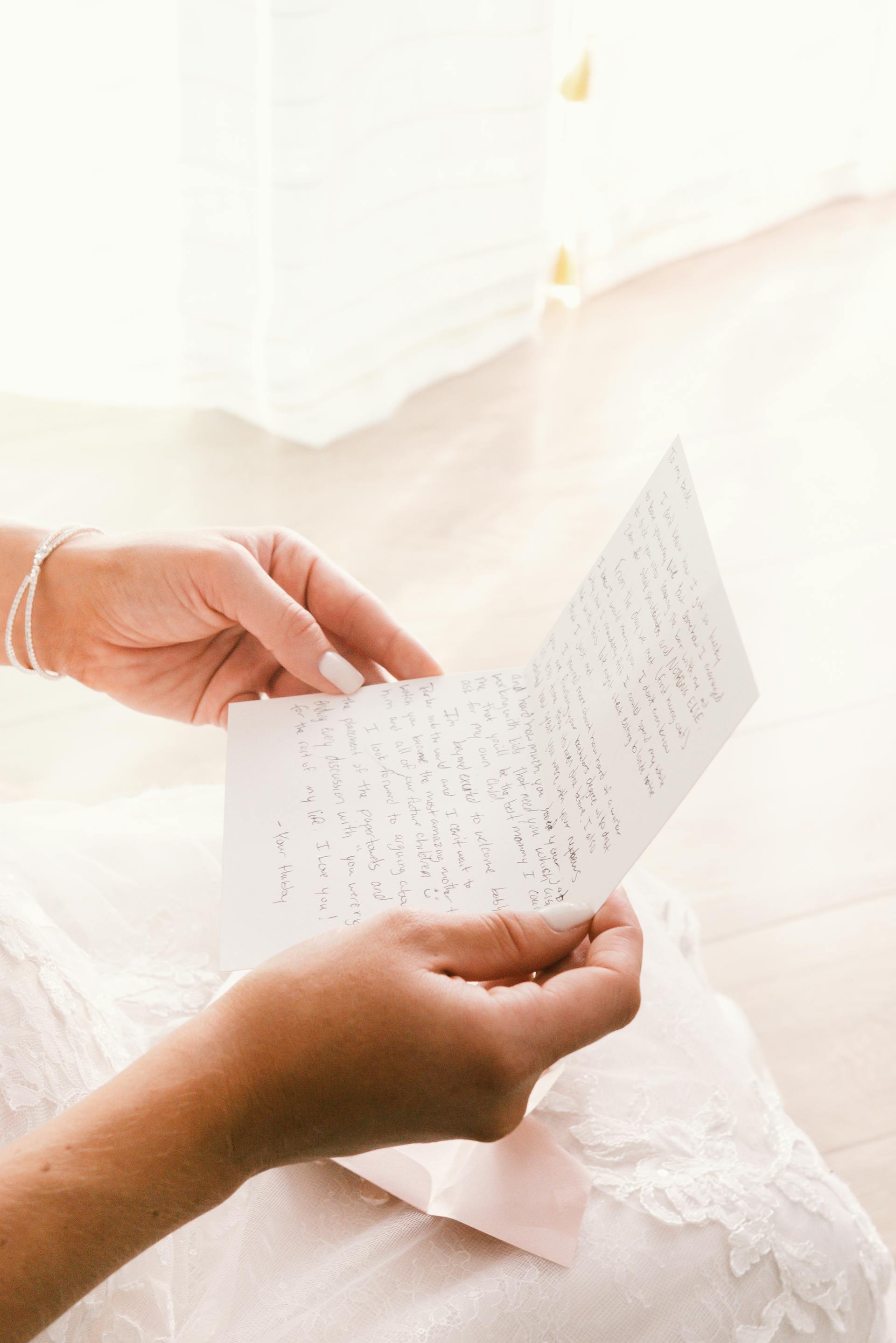 A closeup shot of a woman reading a letter | Source: Pexels