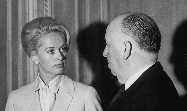 Alfred Hitchcock and Tippi Hedren with a bird on the hand in the Cannes film festival, on the occasion of the presentation of the movie ""birds""1963. | Source: Getty Images