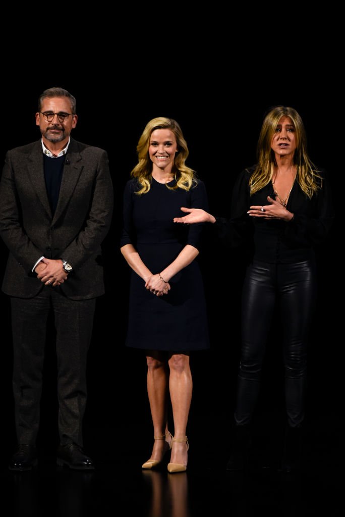 Steve Carrell, Reese Witherspoon, and Jennifer Aniston during an Apple product launch event. | Source: Getty Images