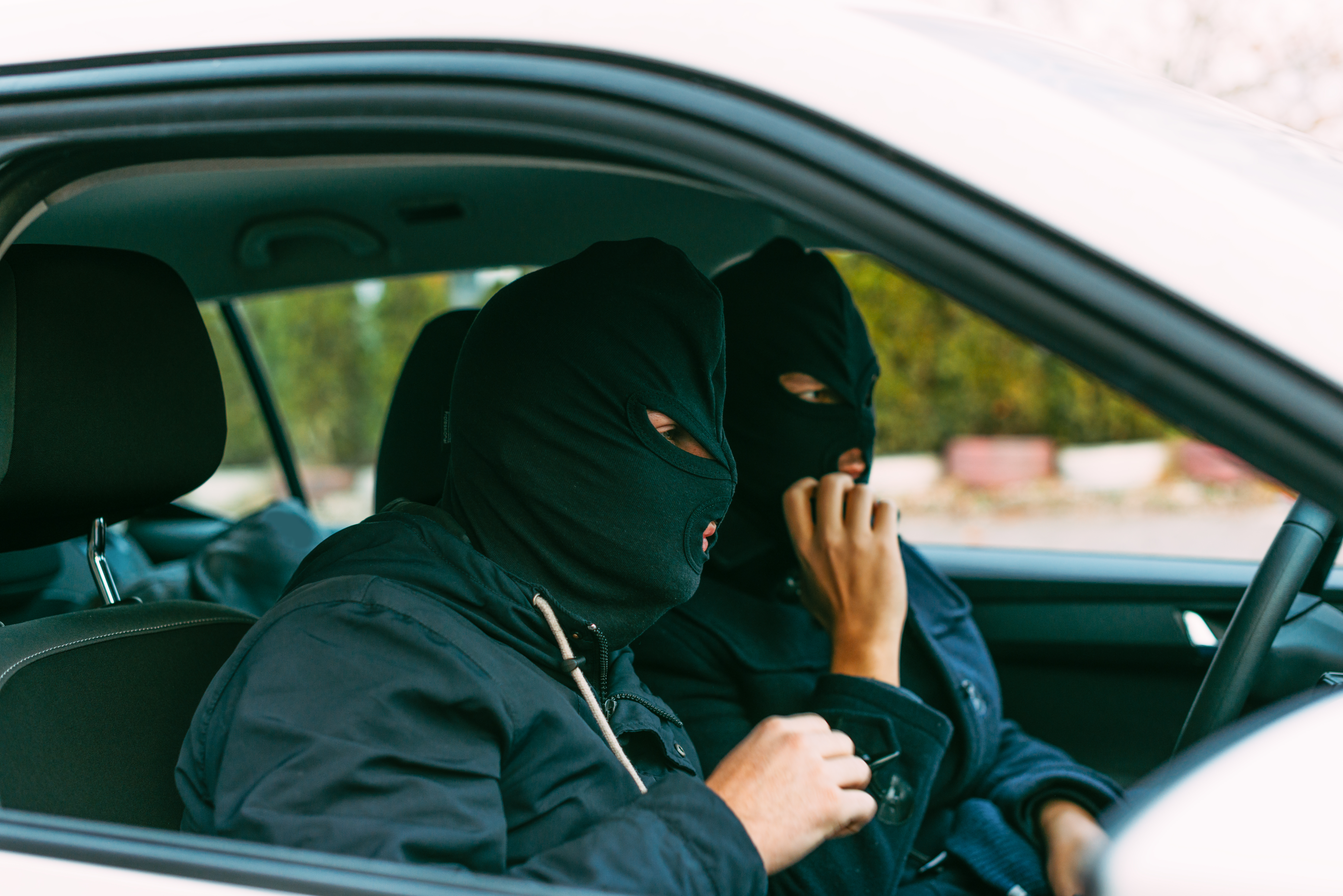Gangsters putting their mask on,prepared to do their next robbery. | Source: Shutterstock