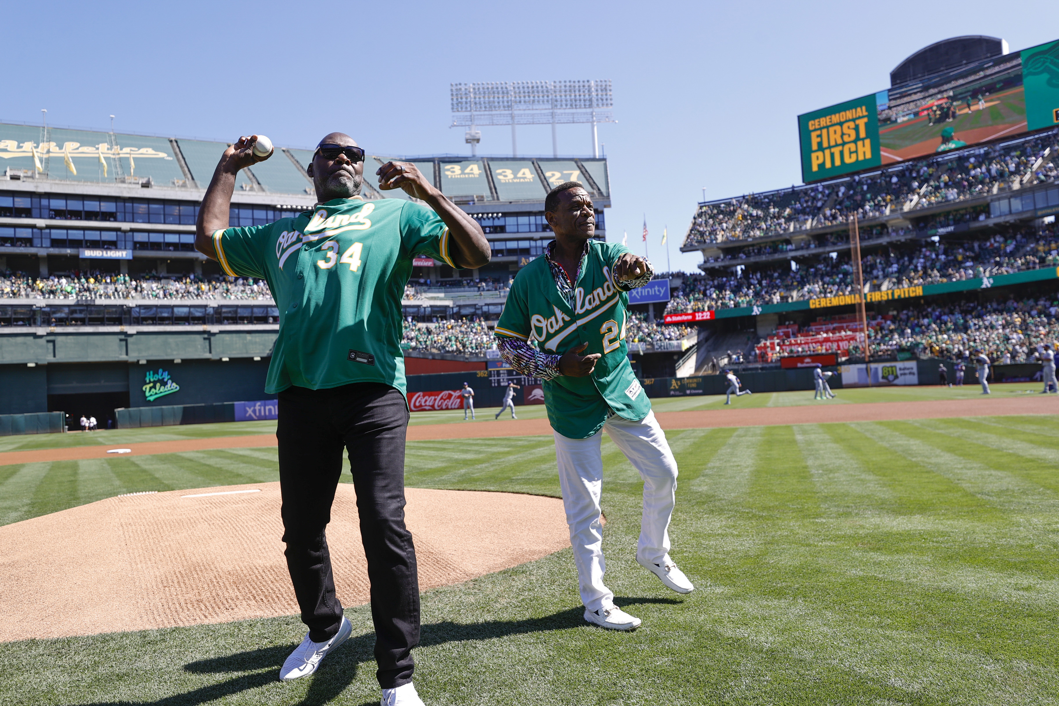 Dave Stewart and Rickey Henderson throw the ceremonial first pitch before the Oakland Athletics vs. Texas Rangers game at the Oakland Coliseum on September 26, 2024 | Source: Getty Images