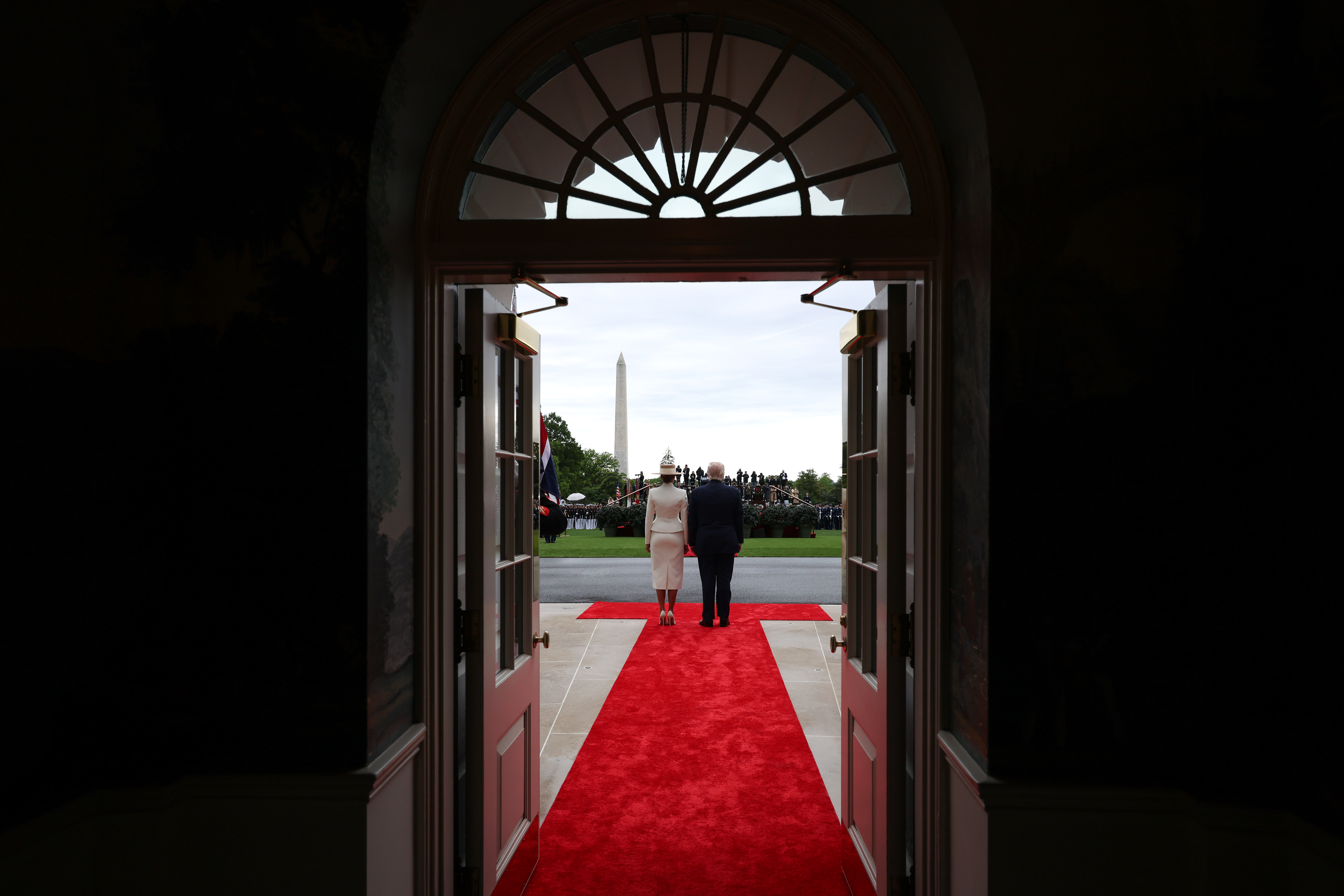 First lady Melania Trump and U.S. President Donald Trump wait for the arrival of King Charles III and Queen Camilla to a state arrival ceremony on the South Lawn of the White House in Washington, DC,  on April 28, 2026. | Source: Getty Images