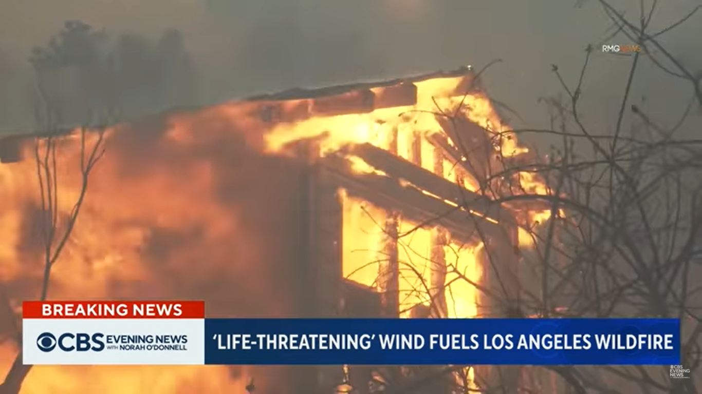 A house engulfed in flames in Los Angeles, California on January 7, 2025. | Source: YouTube/CBSEveningNews