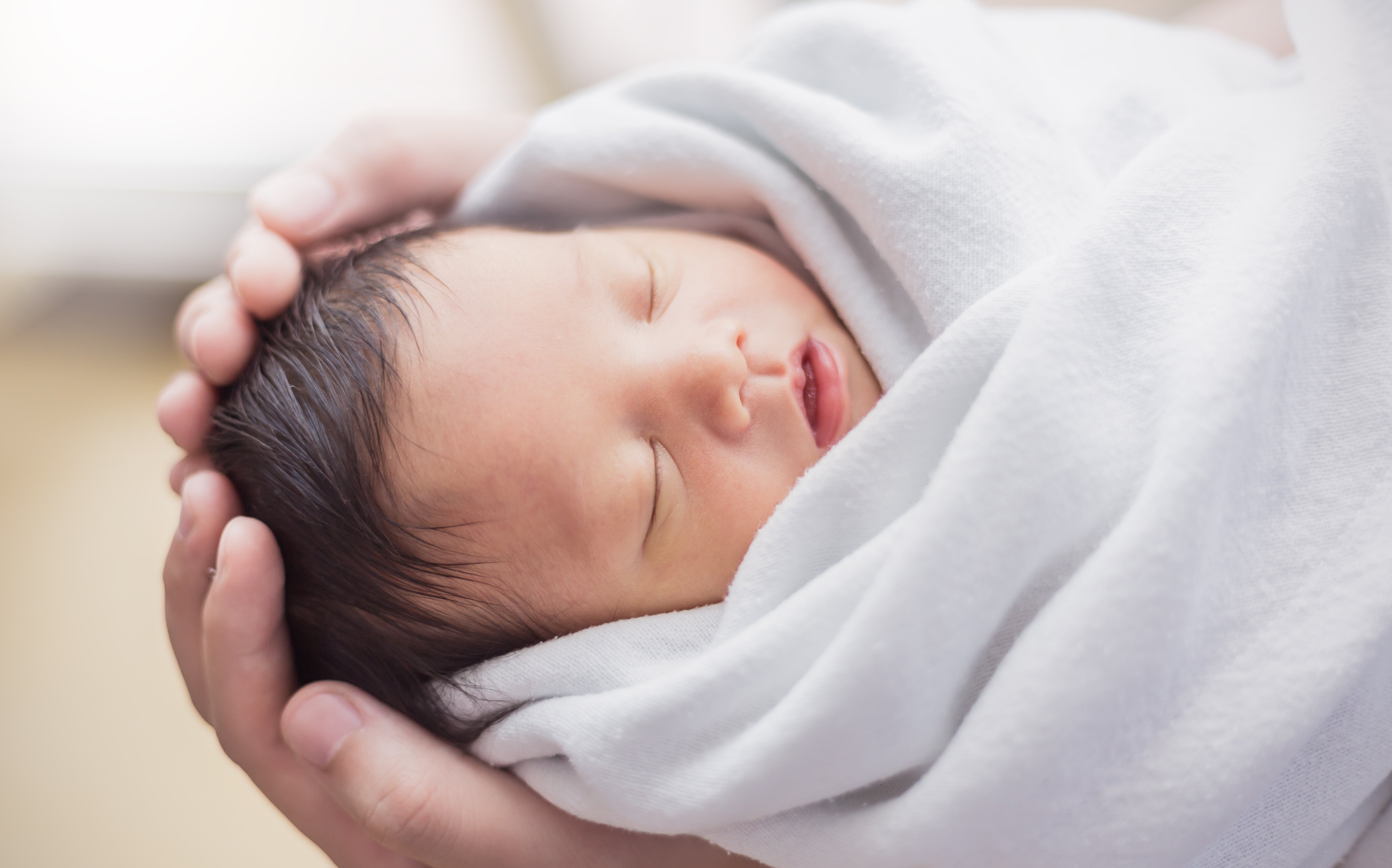 Charles held his granddaughter in his arms for the first time. | Source: Paulaphoto/Shutterstock