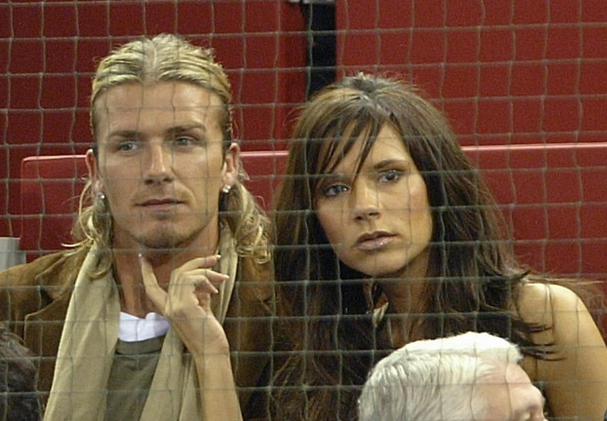 David Beckham and Victoria Beckham watch the Masters Series match between Spaniard Juan Carlos Ferrero and South African Wayne Ferreira in Madrid on October 15, 2003 | Source: Getty Images