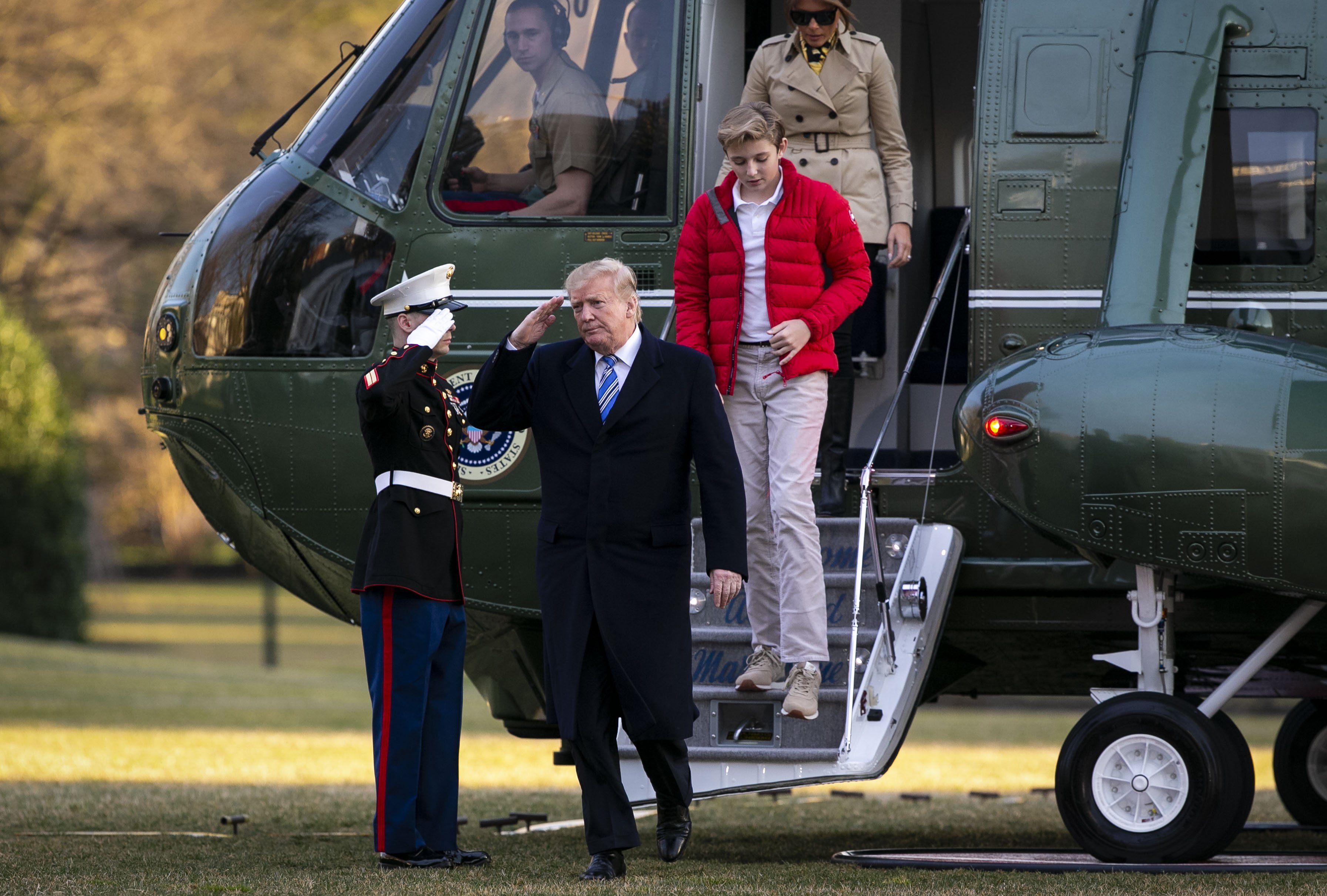 Donald Trump stepping off of Marine One Melania Trump and their son Barron Trump on the South Lawn of the White House, in Washington, DC | Photo: Getty Images