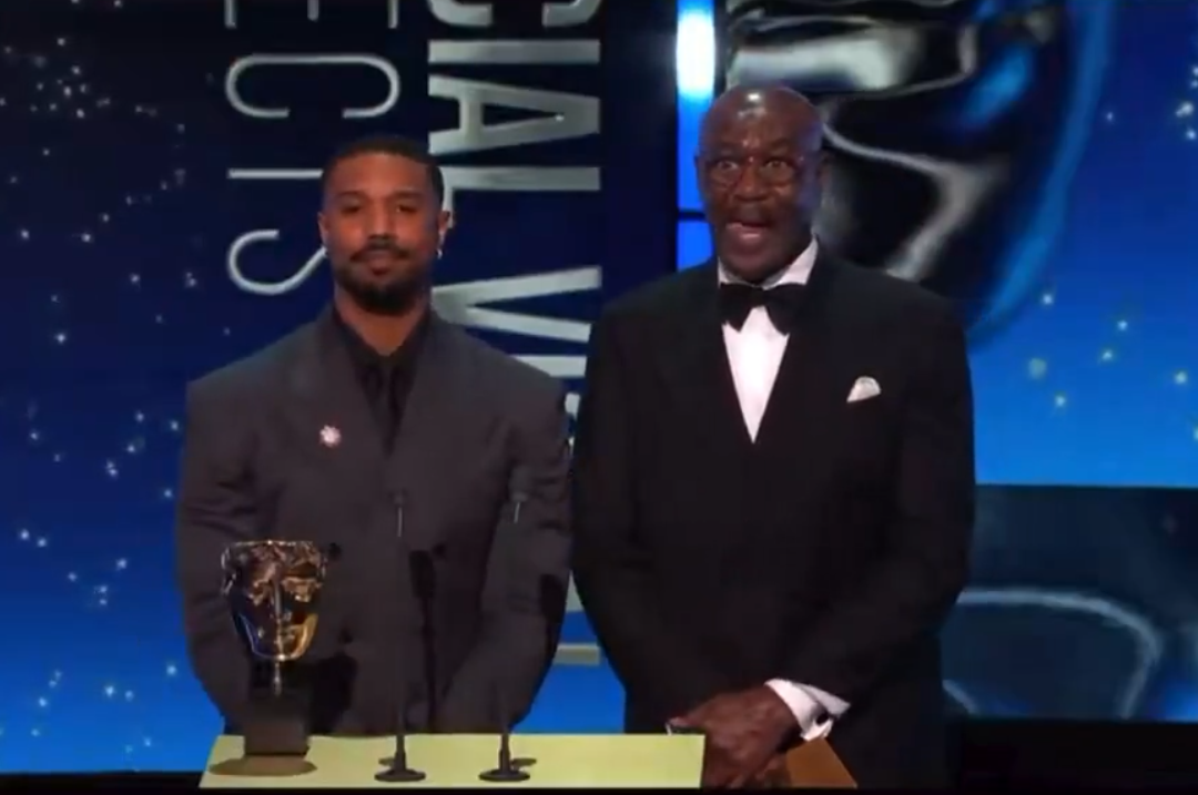 Michael B. Jordan and Delroy Lindo react to a controversial moment at 79th BAFTA Film Awards at The Royal Festival Hall on February 22, 2026, in London, England | Source: X/ANTHONYBLOGAN