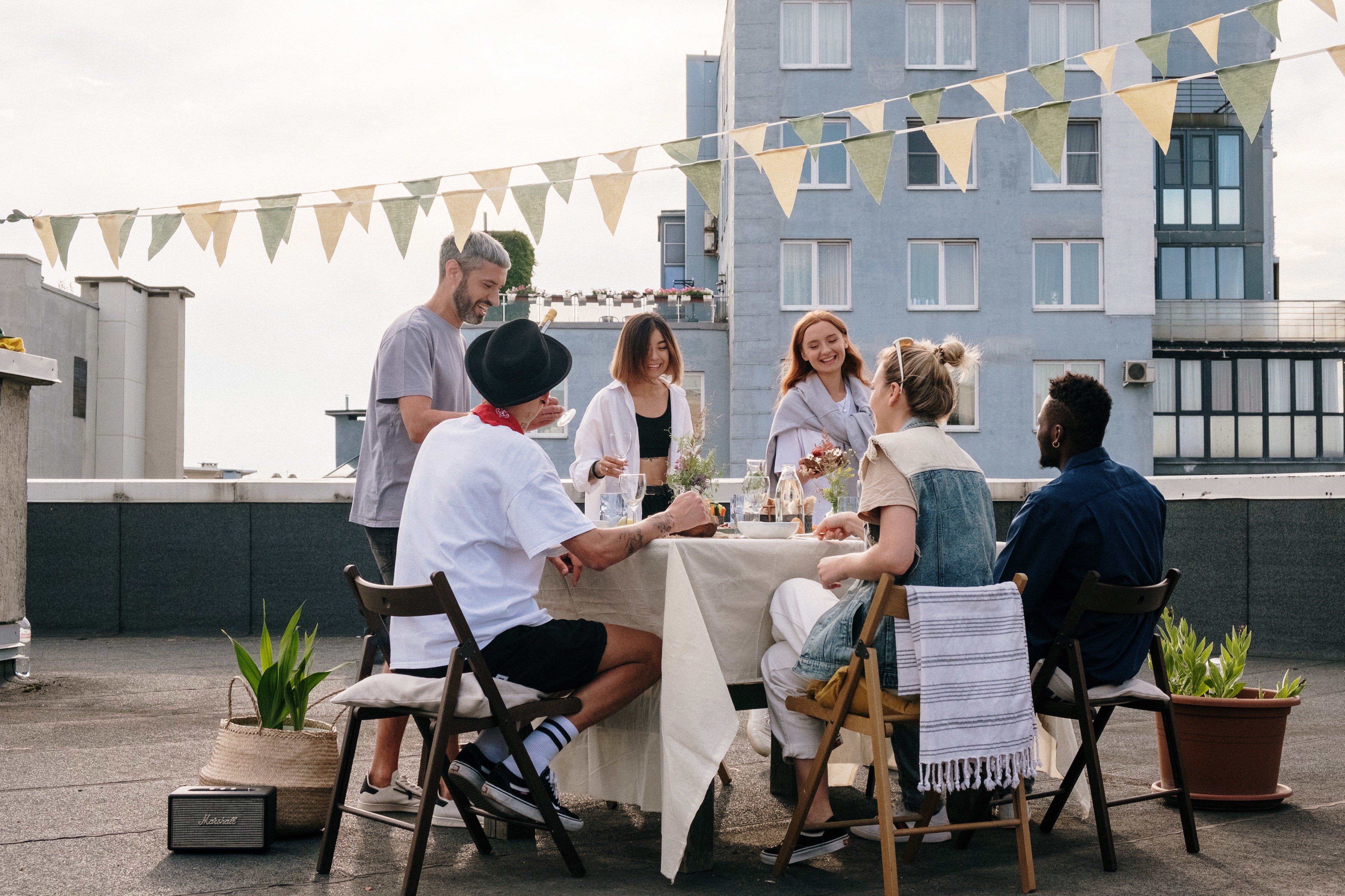 A roof top dinner party. | Pexels