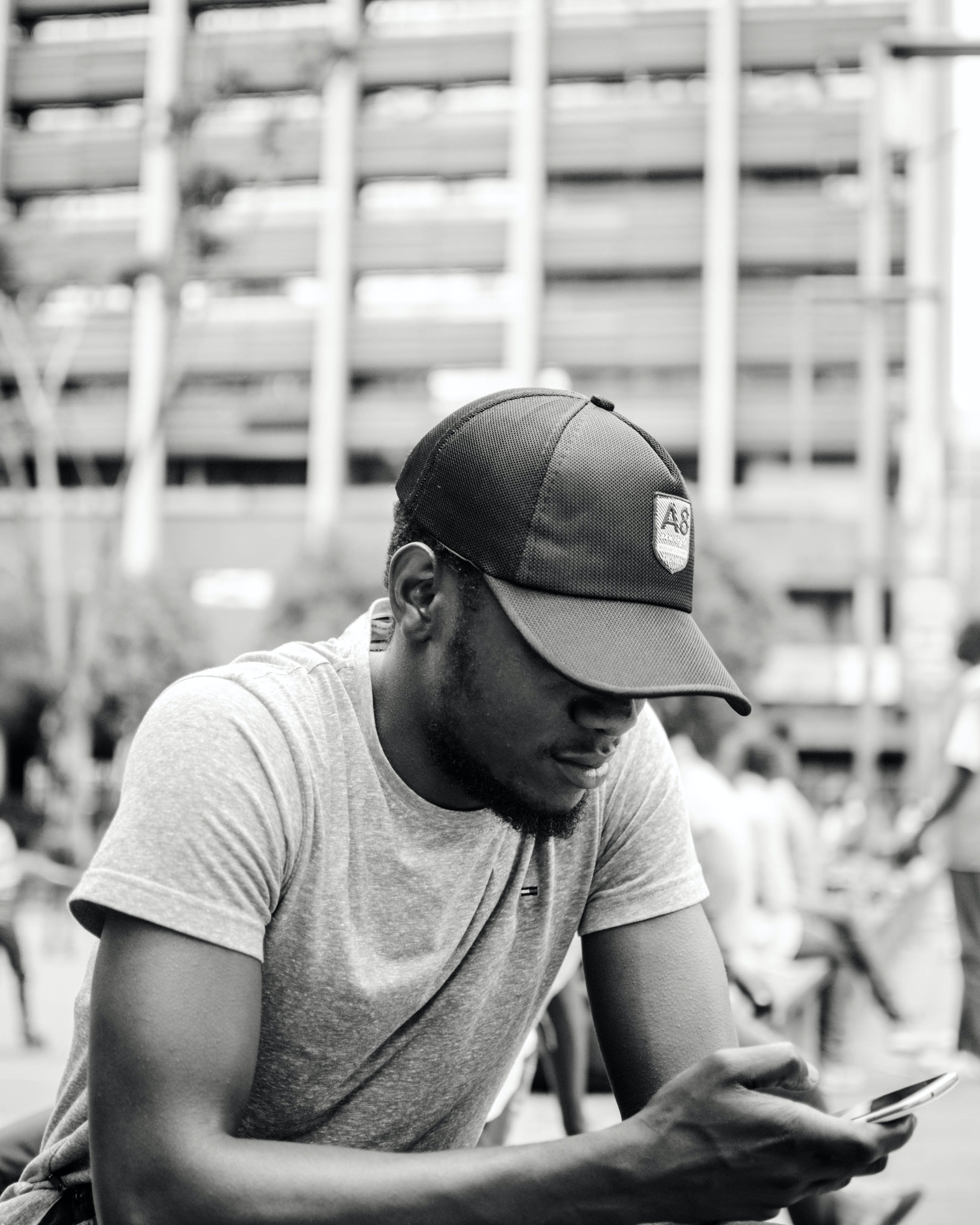 A young man using his phone. | Source: Pexels