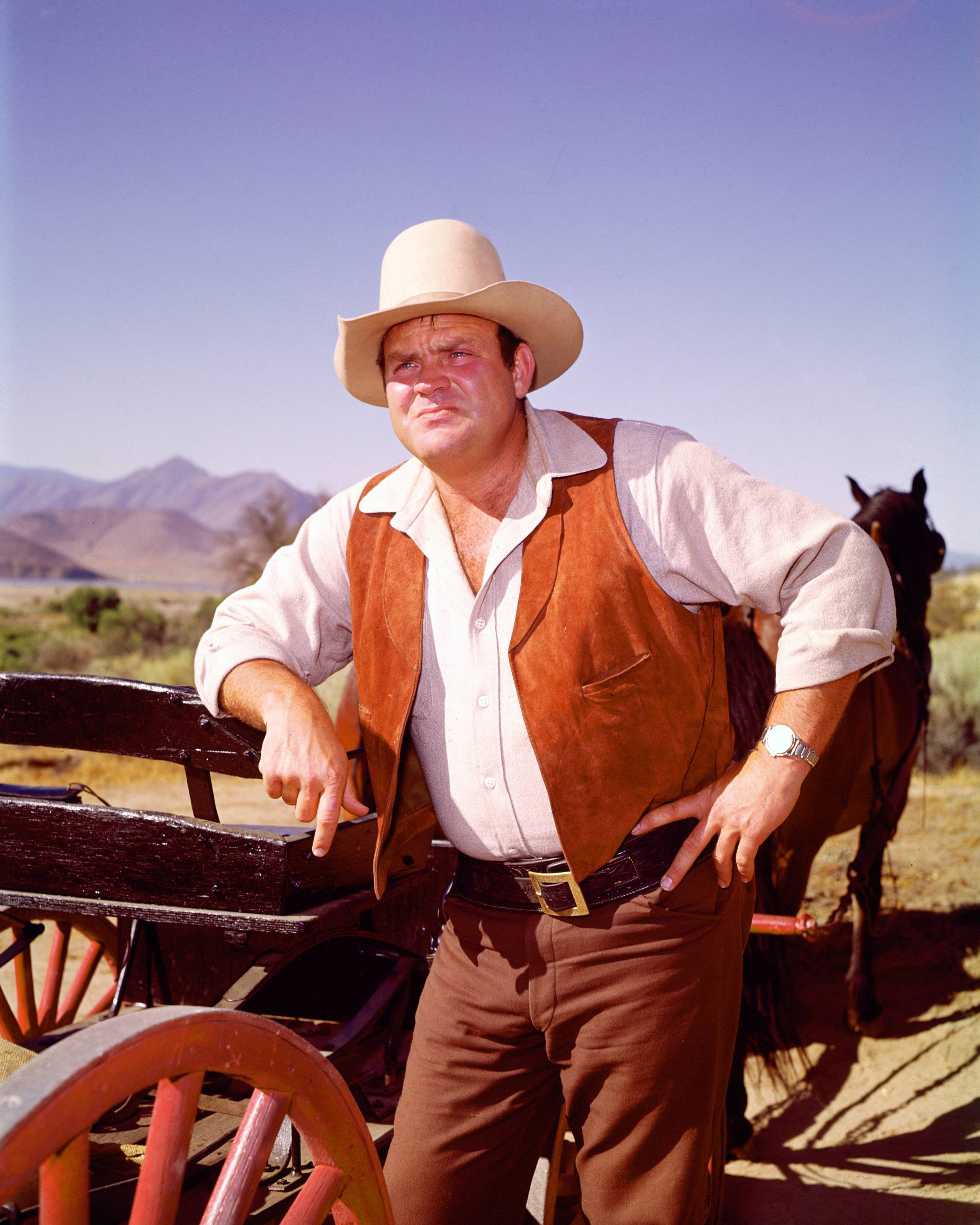 Actor Dan Blocker in costume as he leans against a cart, with a horse in the background, in a publicity portrait issued for the television series, 'Bonanza' in 970. | Source: Silver Screen Collection/ Getty Images 