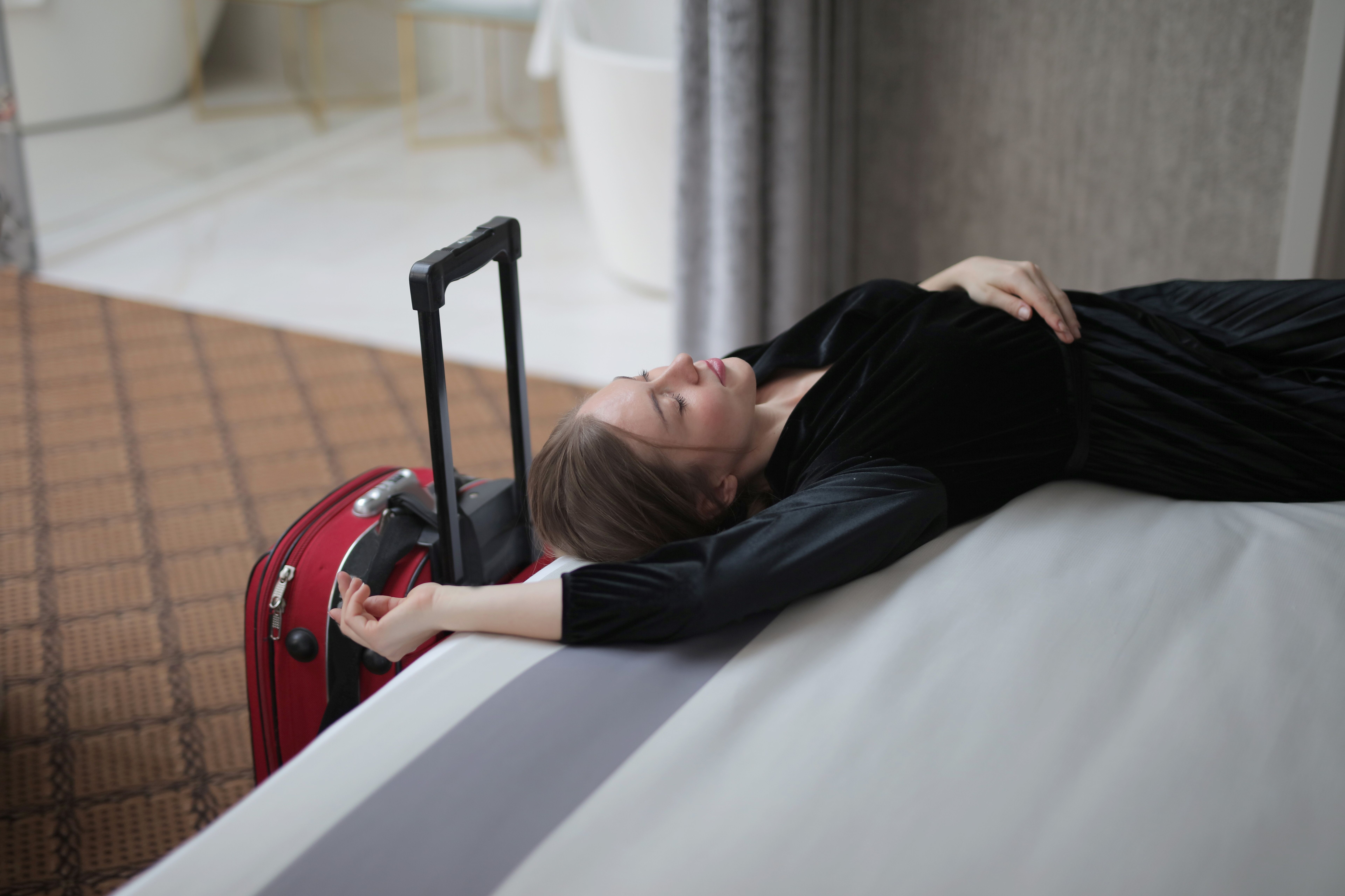 Woman resting in a hotel room | Source: Pexels