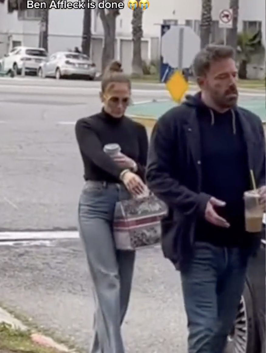 Jennifer Lopez and Ben Affleck walk towards their car as Affleck looks tense on May 12, 2023 | Source: TikTok/@dailymail