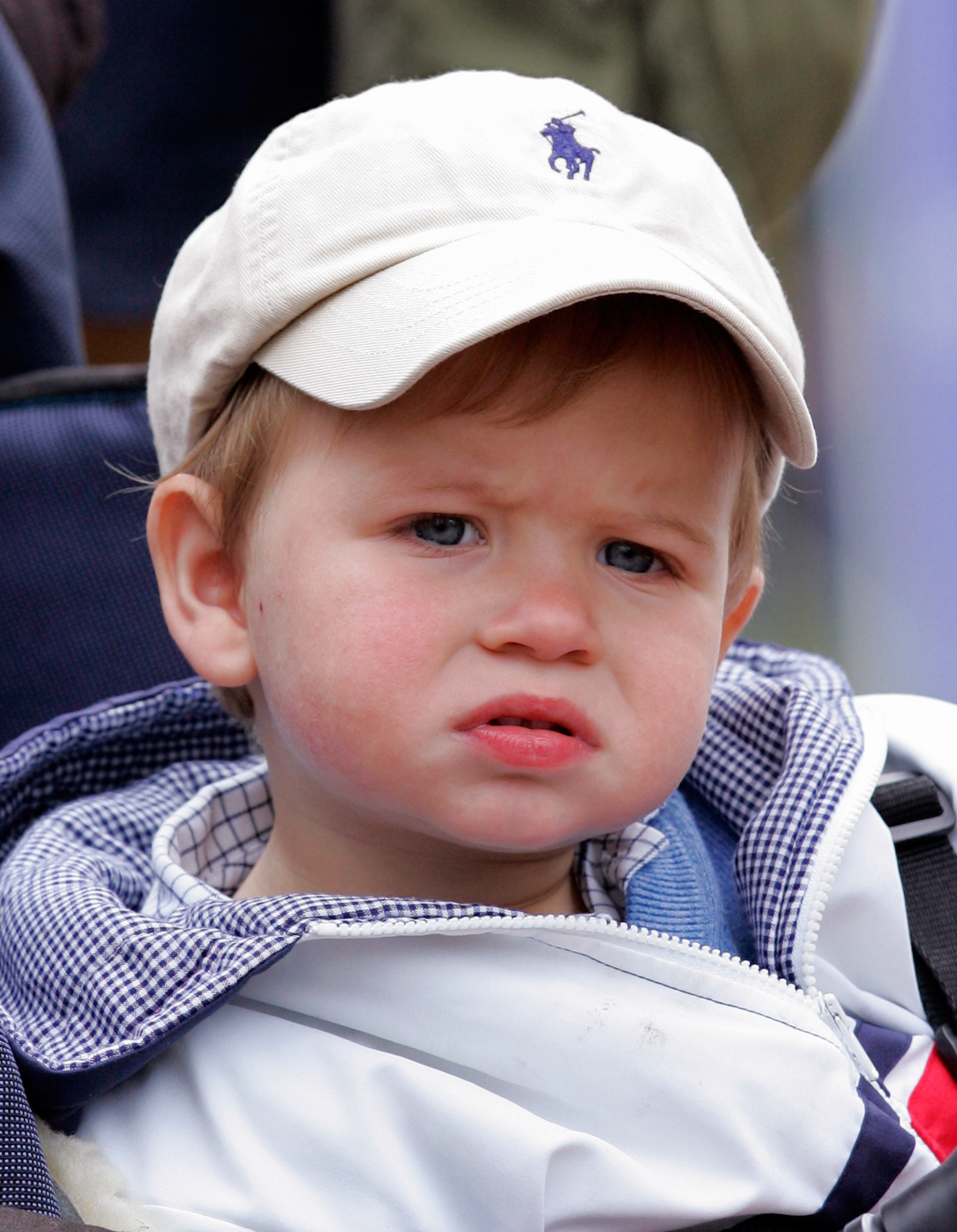 Little James gazes on with wonder during the Royal Windsor Horse Show in May 2009. The young Viscount Severn joined his father, Prince Edward, for a rare public appearance — charming royal watchers with his curious expression and quiet poise.