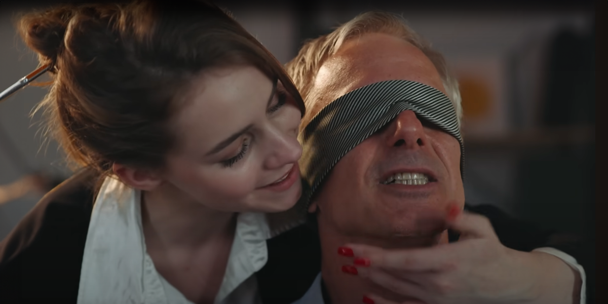 Woman blindfolds a man | Source: YouTube/DramatizeMe