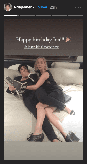 Jennifer Lawrence and Kris Jenner posing together on a bed. | Photo: Instagram/@krisjenner