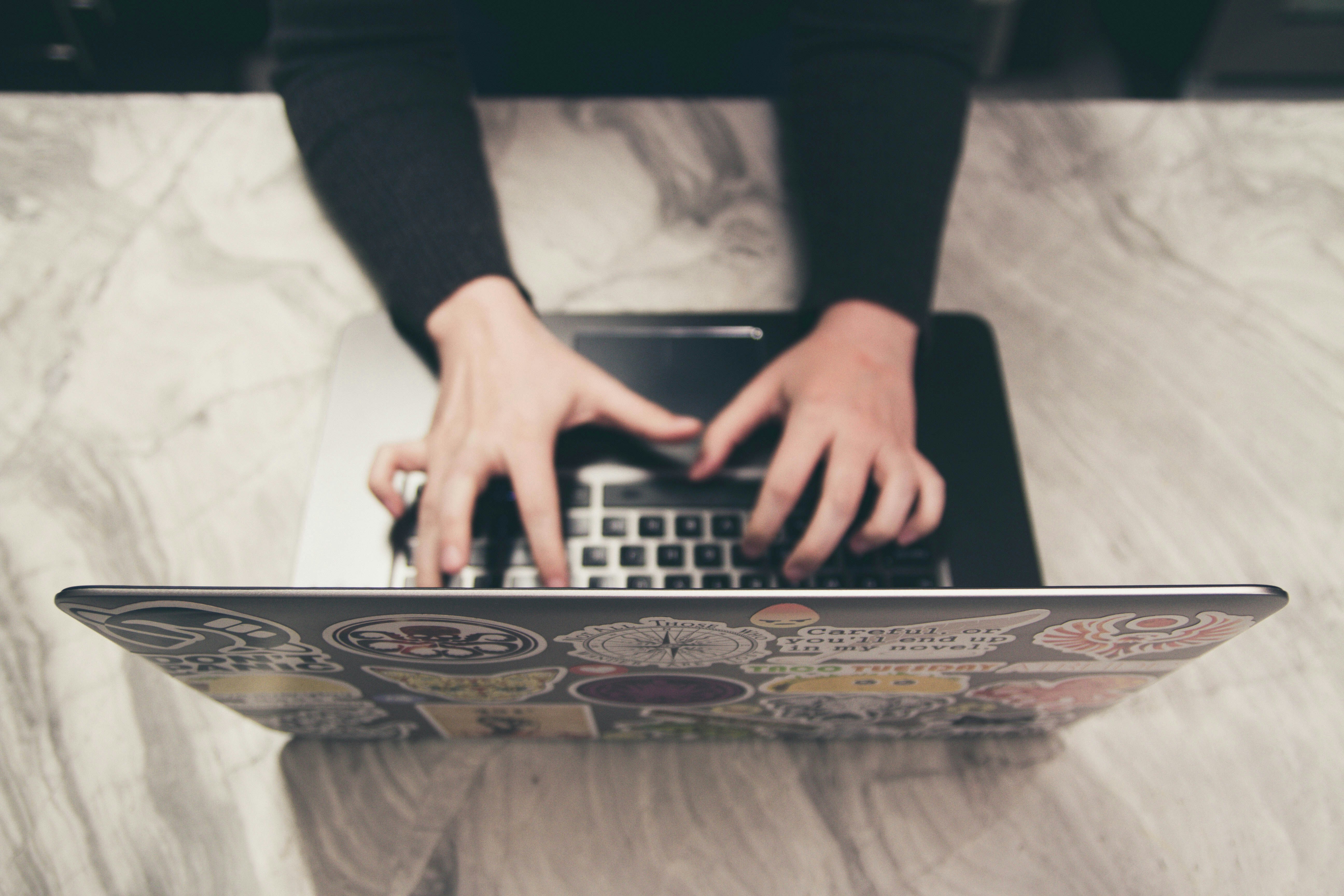 A person typing on a laptop | Source: Unsplash