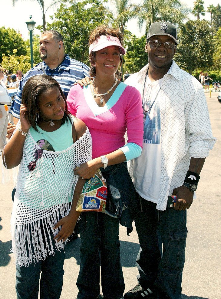 Whitney Houston, Bobby Brown & their daughter, Bobbi Kristina at Disneyland on Aug. 7, 2004 | Photo: Getty Images