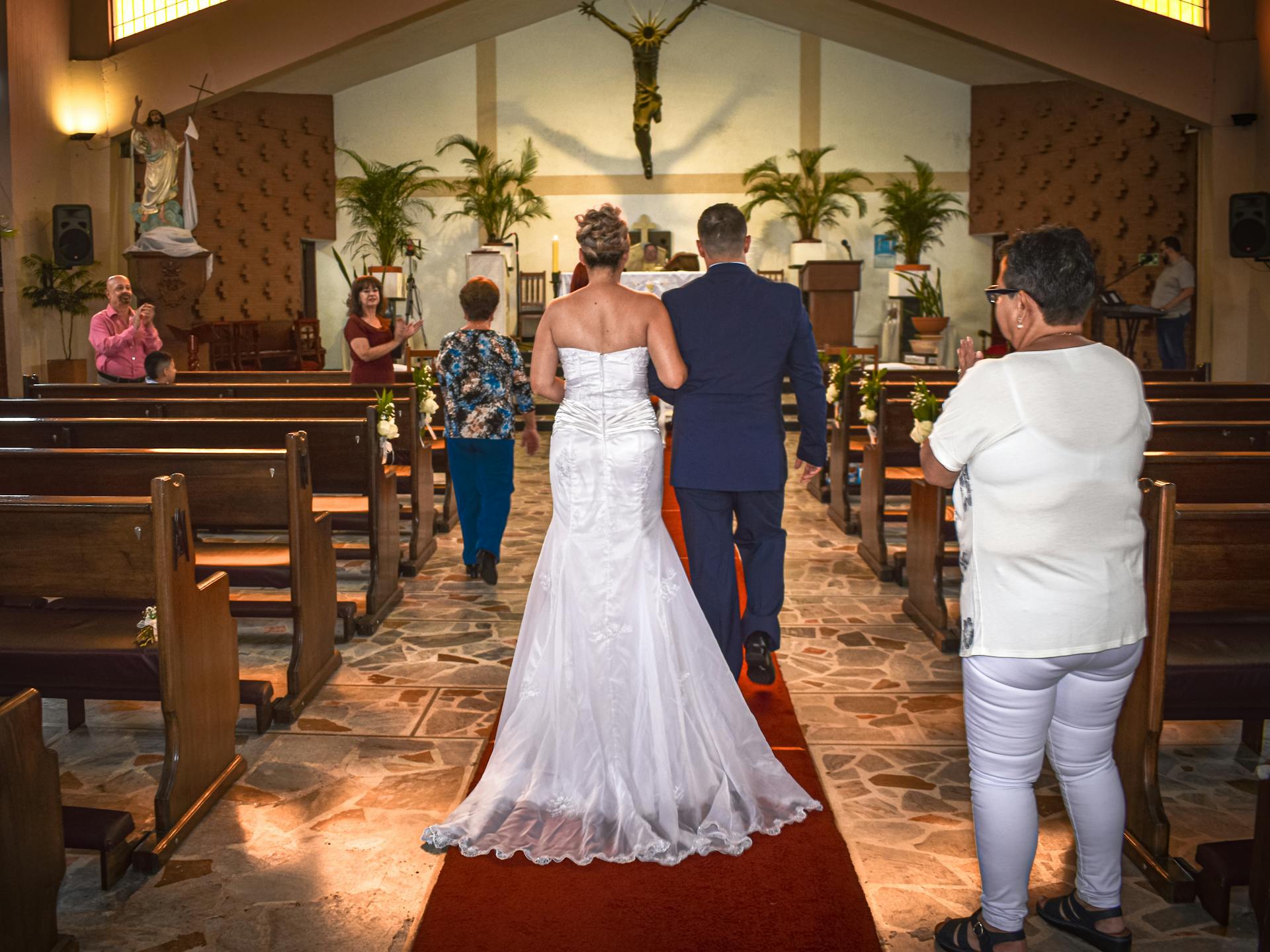 A couple walking down the aisle | Source: Midjourney