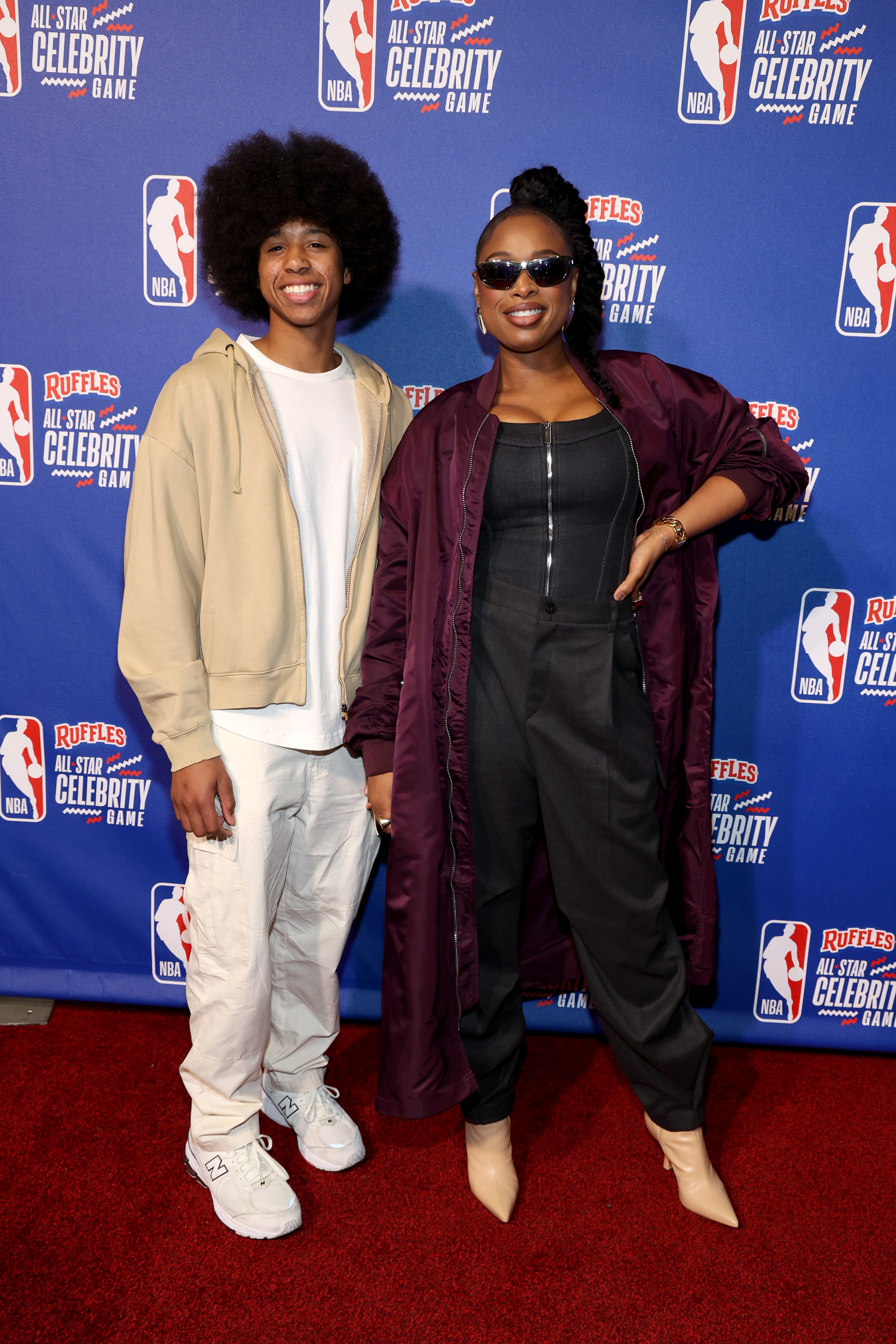 David Daniel Otunga Jr. and Jennifer Hudson attend the 2024 Ruffles NBA All-Star Celebrity Game in Indianapolis, Indiana | Source: Getty Images