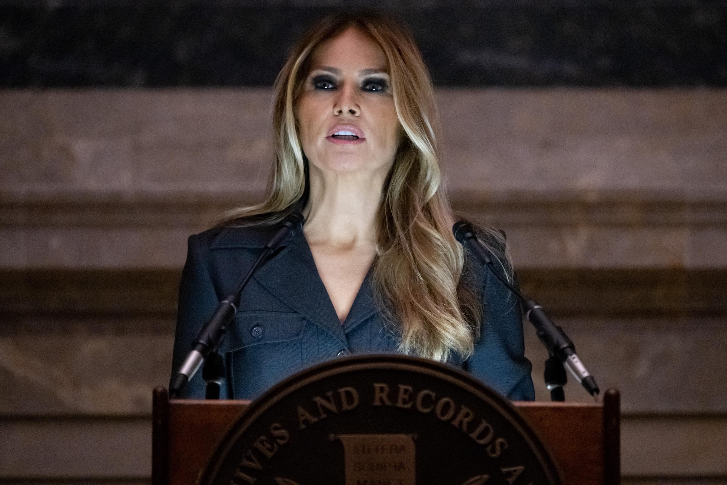 Melania Trump wore dramatic eye makeup and long highlighted hair in this appearance. The close-up image became one of the more distinctive recent photos of her.