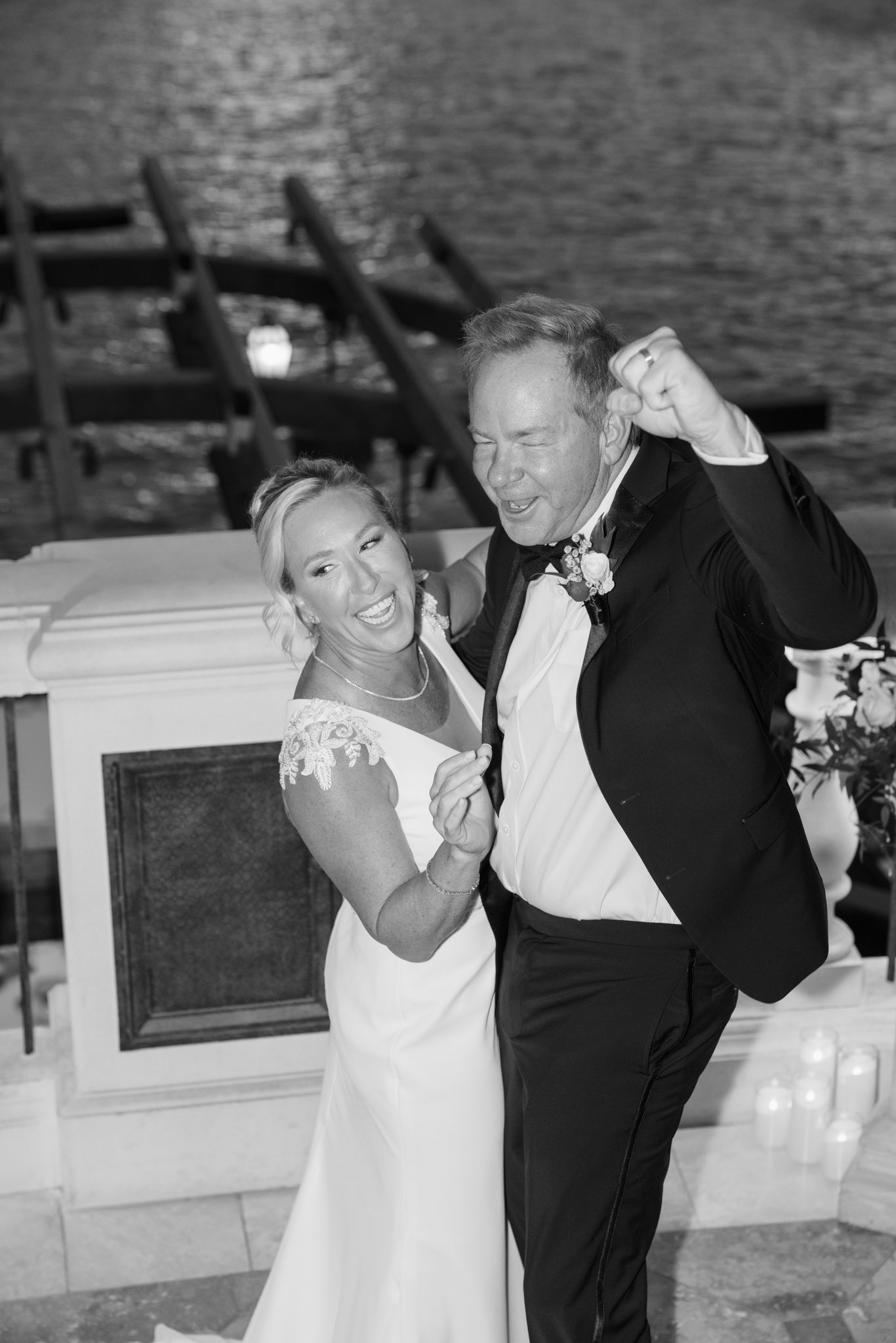 Pure excitement filled the air as the ecstatic newlyweds pumped their fists and cheered right after making it official. Captured in candid black and white, this joyous shot shows the couple letting loose in total bliss. | Source: X/mtgreenee