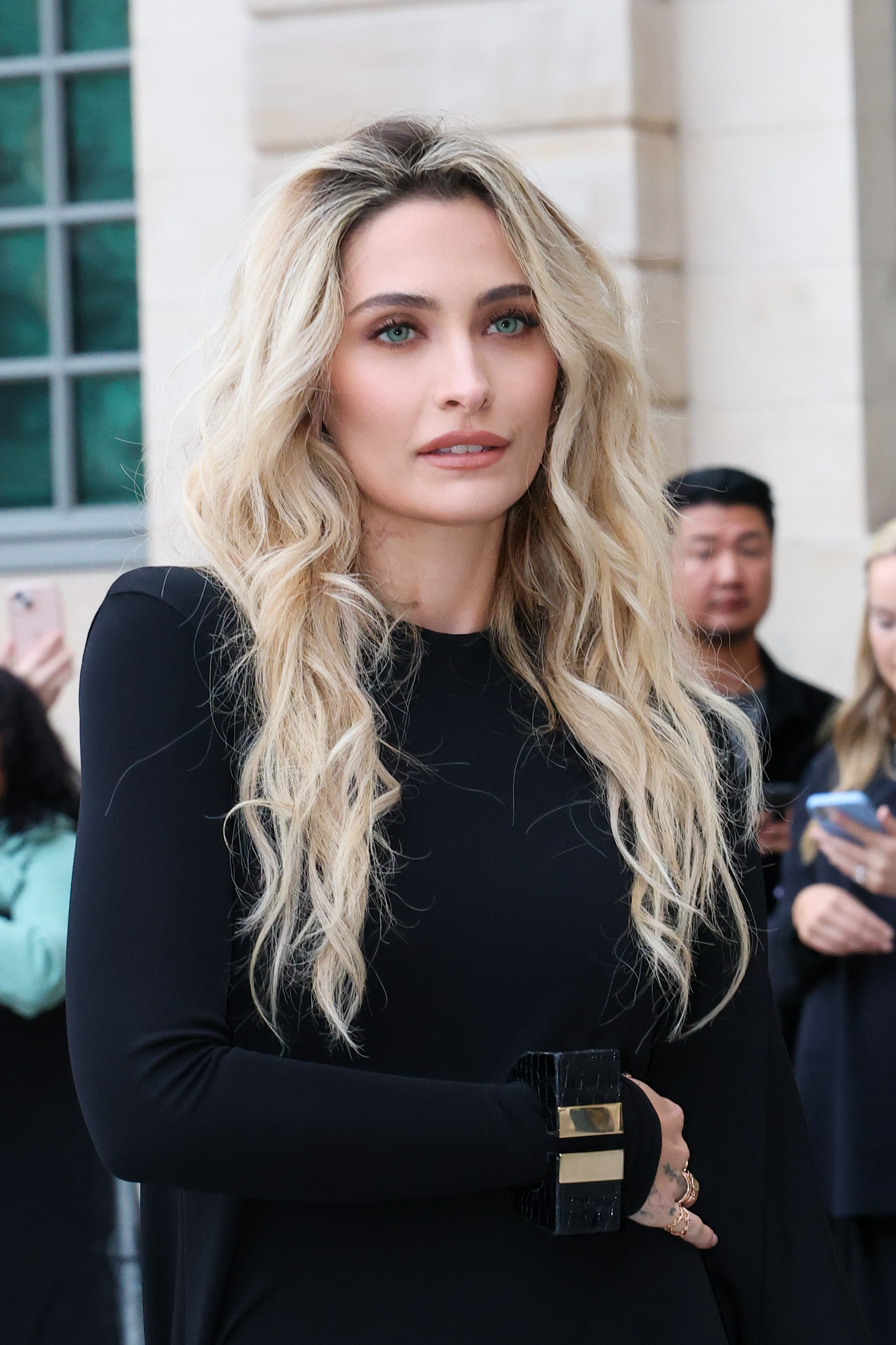 Paris Jackson attends the Tom Ford Womenswear Spring/Summer 2026 show during Paris Fashion Week on October 1, 2025, in Paris, France. Dressed in a sleek black gown with a daring thigh-high slit, she exuded confidence and elegance as she took her place among the fashion elite.