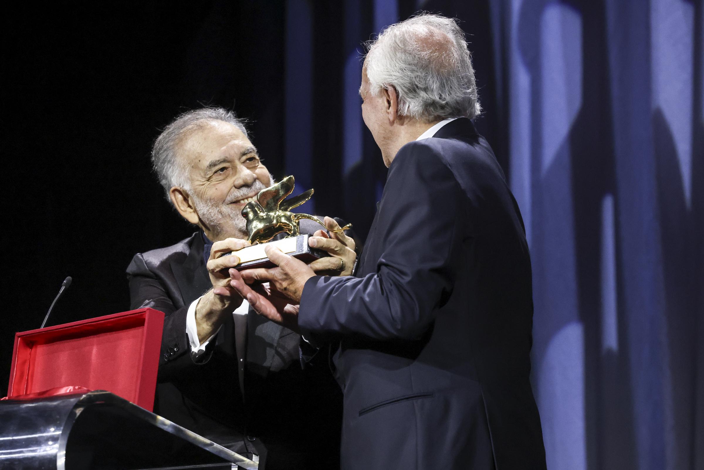 Werner Herzog receiving the Golden Lion for Lifetime Achievement Award from Francis Ford Coppola during the opening ceremony of the 82nd Venice International Film Festival on August 27, 2025, in Italy. | Source: Getty Images