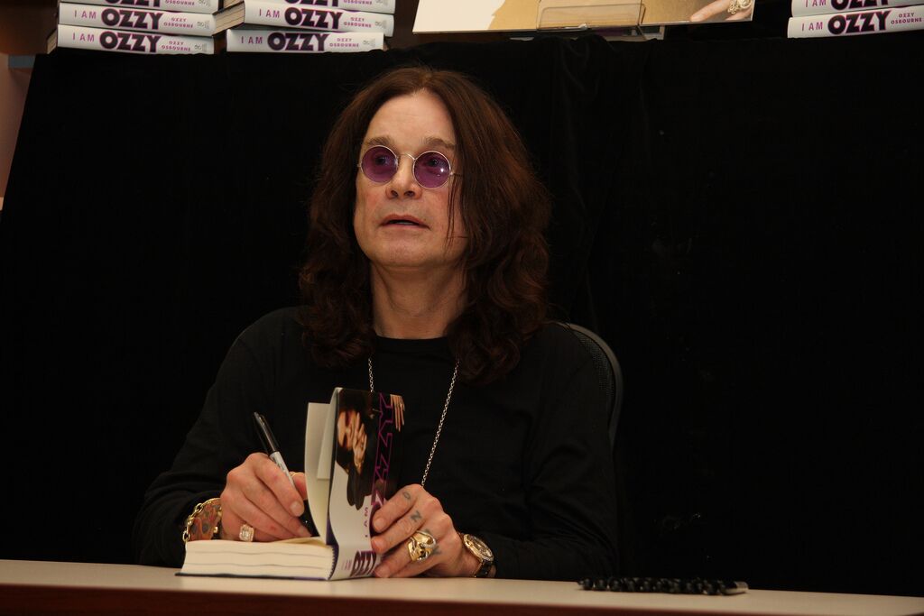Ozzy Osbourne signs copies of "I Am Ozzy" book. | Source: Flickr