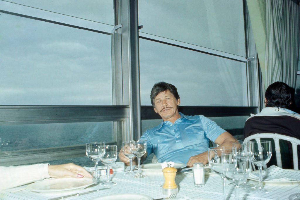 American actor Charles Bronson relaxing at a restaurant, France, 1970s. | Photo: Getty images