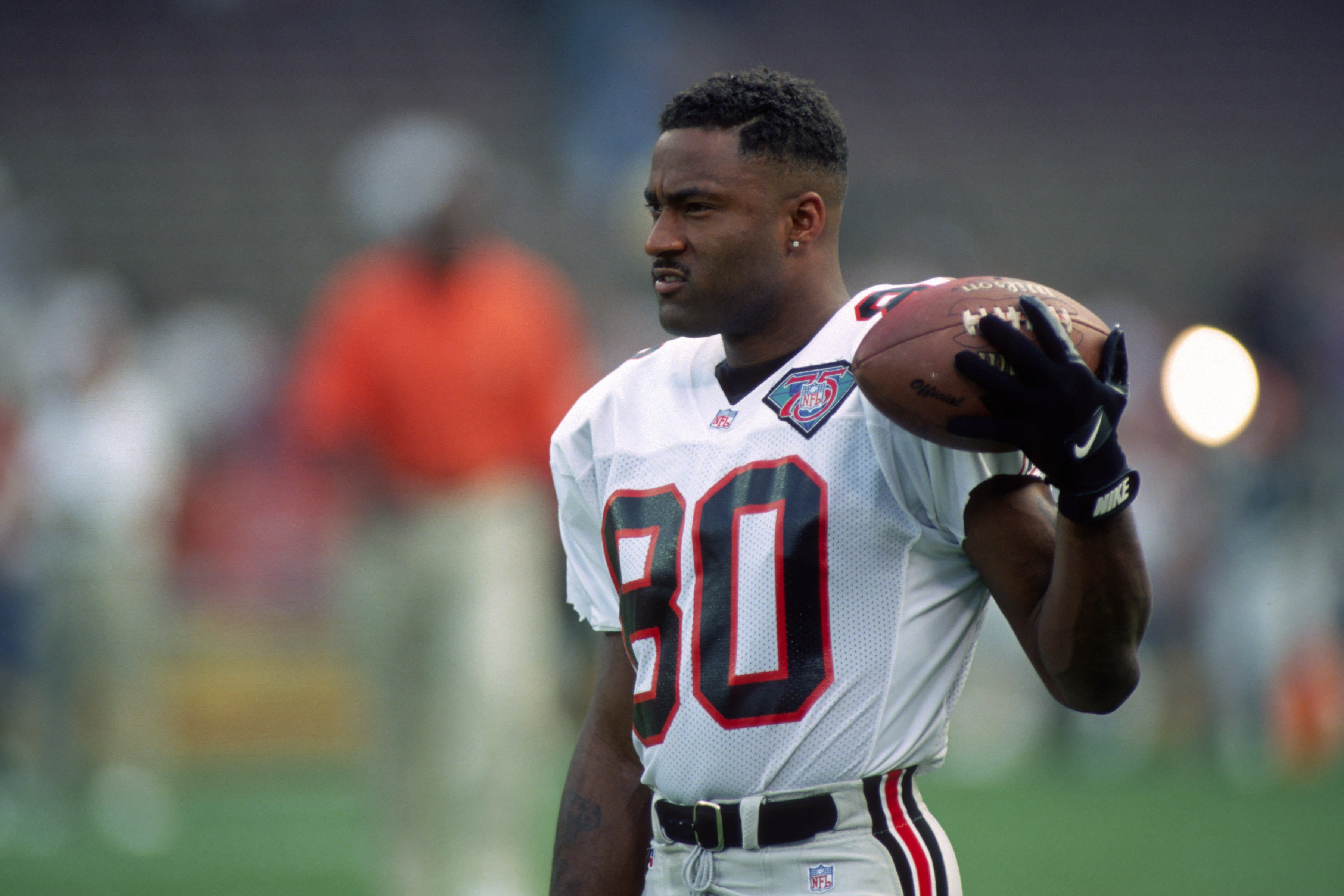  Andre Rison #80 of the Atlanta Falcons looks on from the field during pregame warmup prior to a preseason game against the Cleveland Browns at Cleveland Browns Stadium on August 19, 1994| Photo: Getty Images