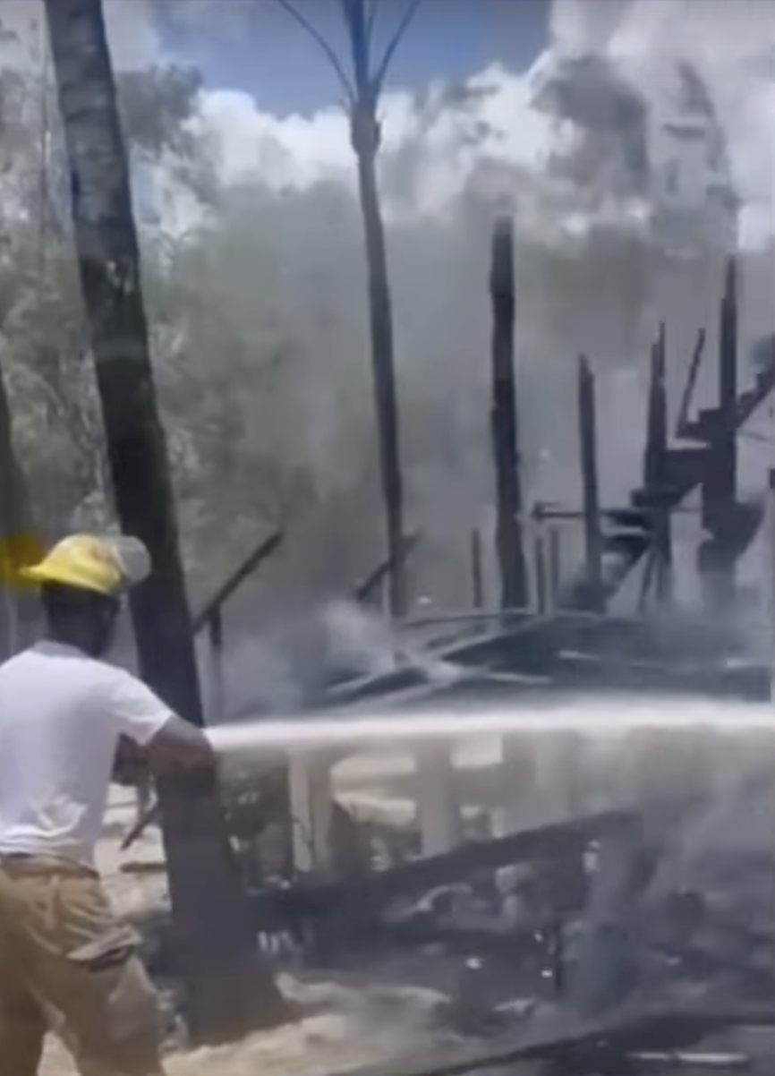 A firefighter helping to extinguish the fire in Marc Anthony's Dominican Republic home from a video dated August 9, 2024 | Source: YouTube/El Gordo Y La Flaca